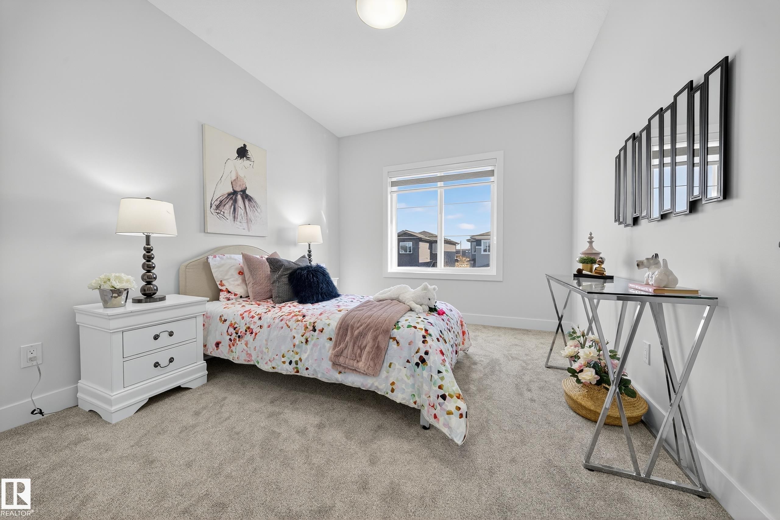 Carpeted bedroom featuring white walls and a large window - 372 Creekside Green, Leduc, AB