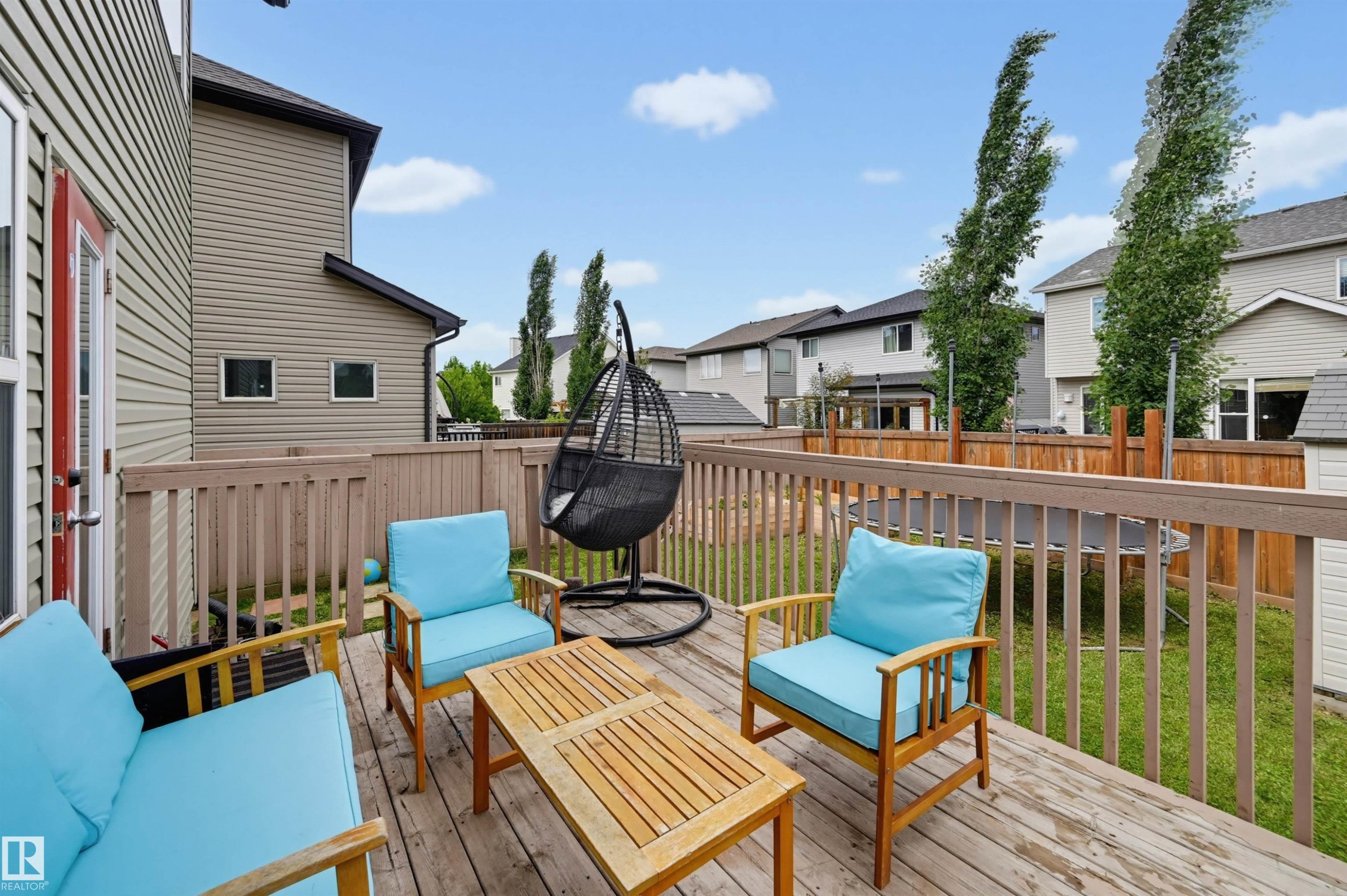 Expansive wood deck with a full railing and direct outdoor access - 21928 97 Avenue Nw, Edmonton, AB - Outdoor With Deck Patio Veranda With Exterior
