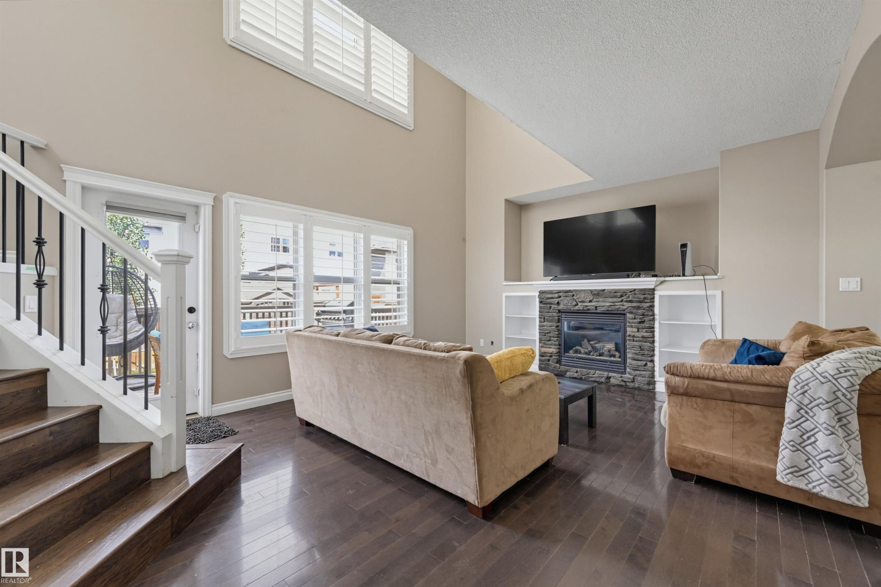 Living room - 21928 97 Avenue Nw, Edmonton, AB - Indoor Photo Showing Living Room With Fireplace