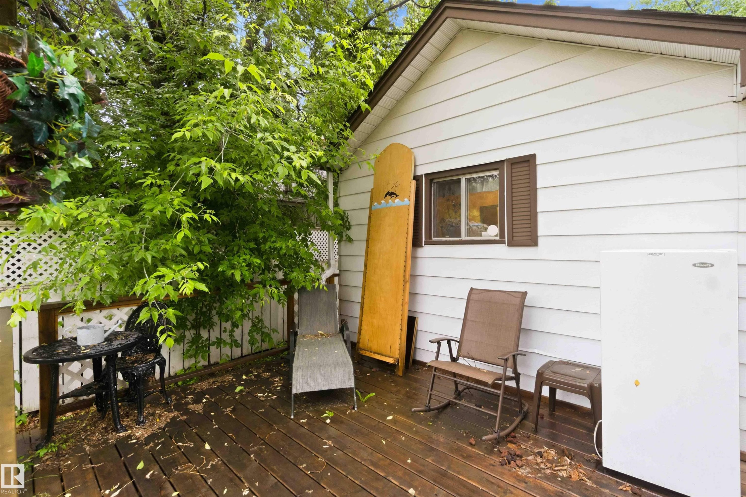 Exterior deck with white siding and brown trim - 12016 61 Street, Edmonton, AB