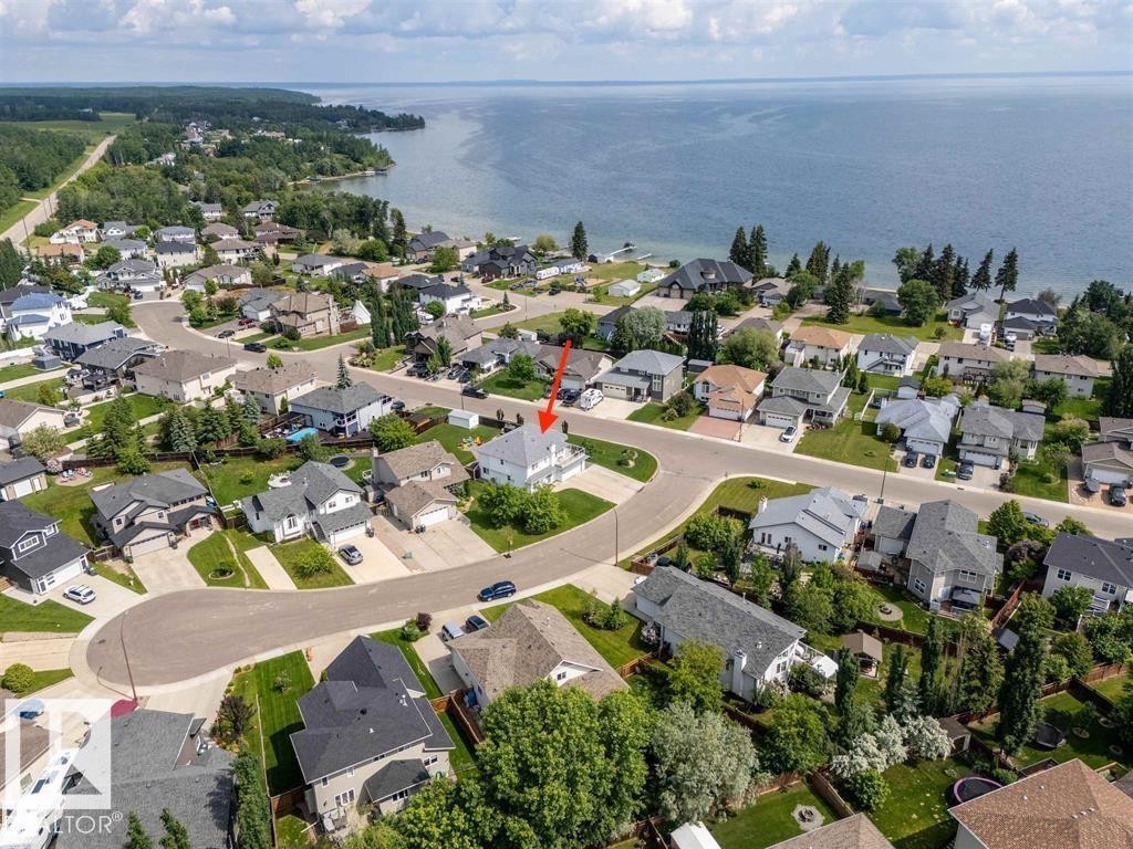 Aerial perspective showcasing a residential neighborhood with waterfront properties - 2602 Delta Road, Cold Lake, AB
