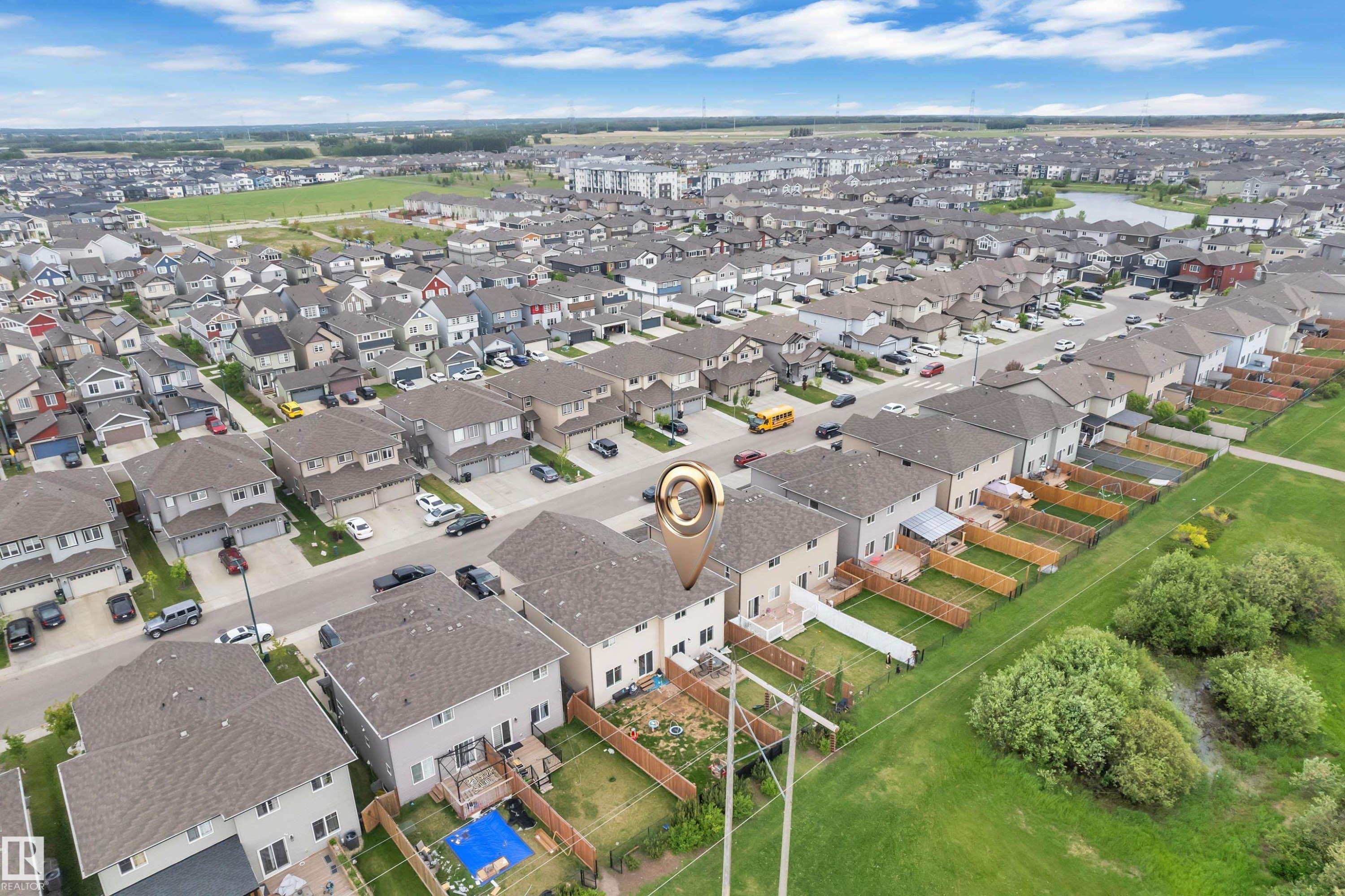 Aerial view of a residential community featuring single-family homes with fenced backyards - 1750 27 Street, Edmonton, AB