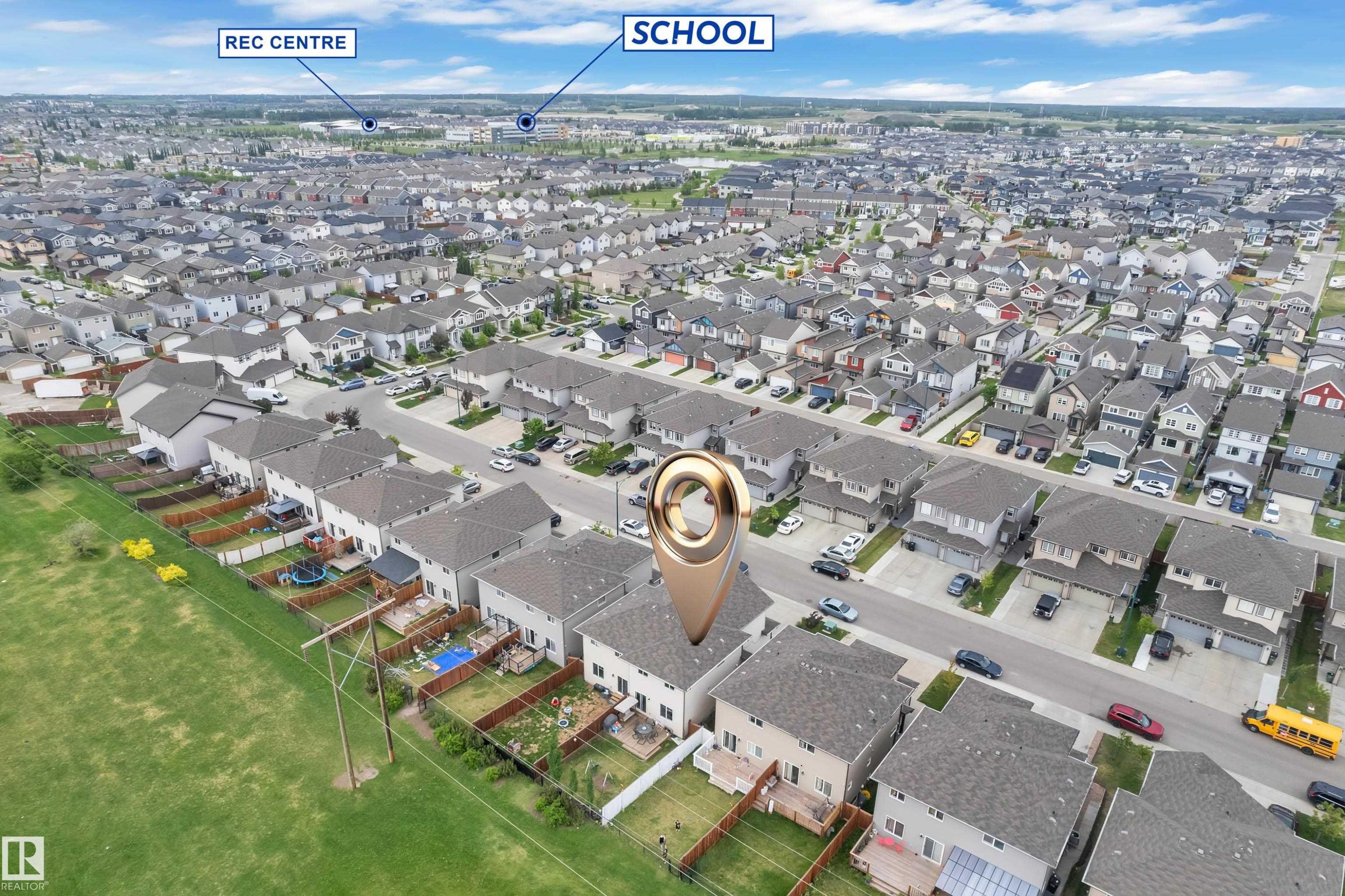 Aerial perspective showcasing a residential development with numerous single-family homes, paved streets, and a uniform architectural style - 1750 27 Street, Edmonton, AB