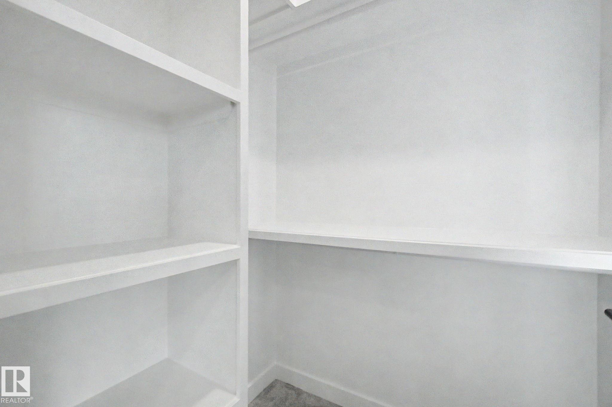 Built-in shelving with multiple storage compartments - 4 Willow Heights Drive, Stony Plain, AB