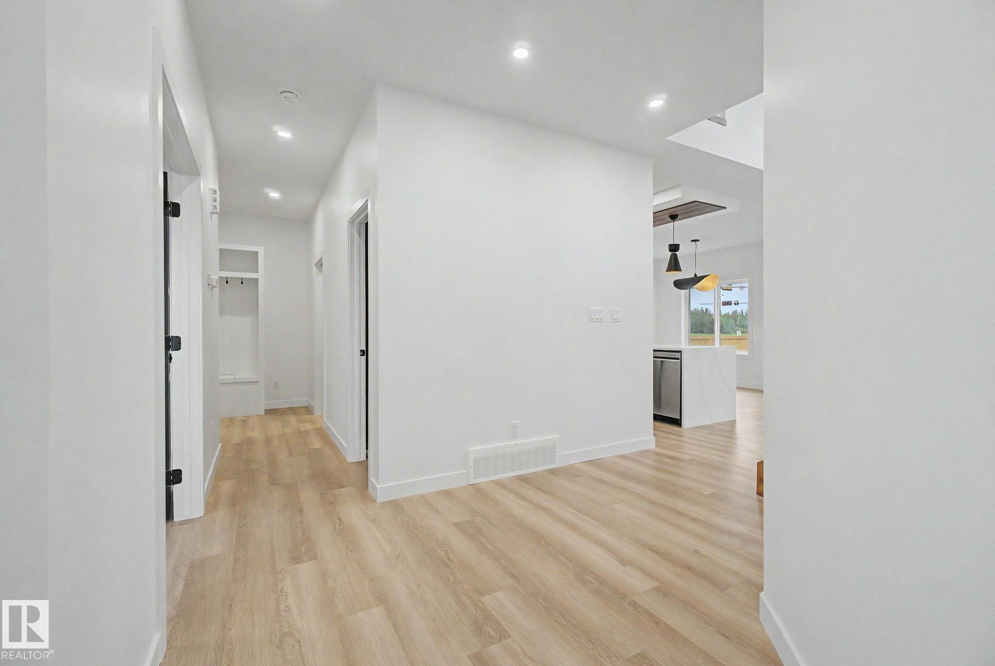 Entryway featuring wood-finish flooring and recessed lighting - 4 Willow Heights Drive, Stony Plain, AB