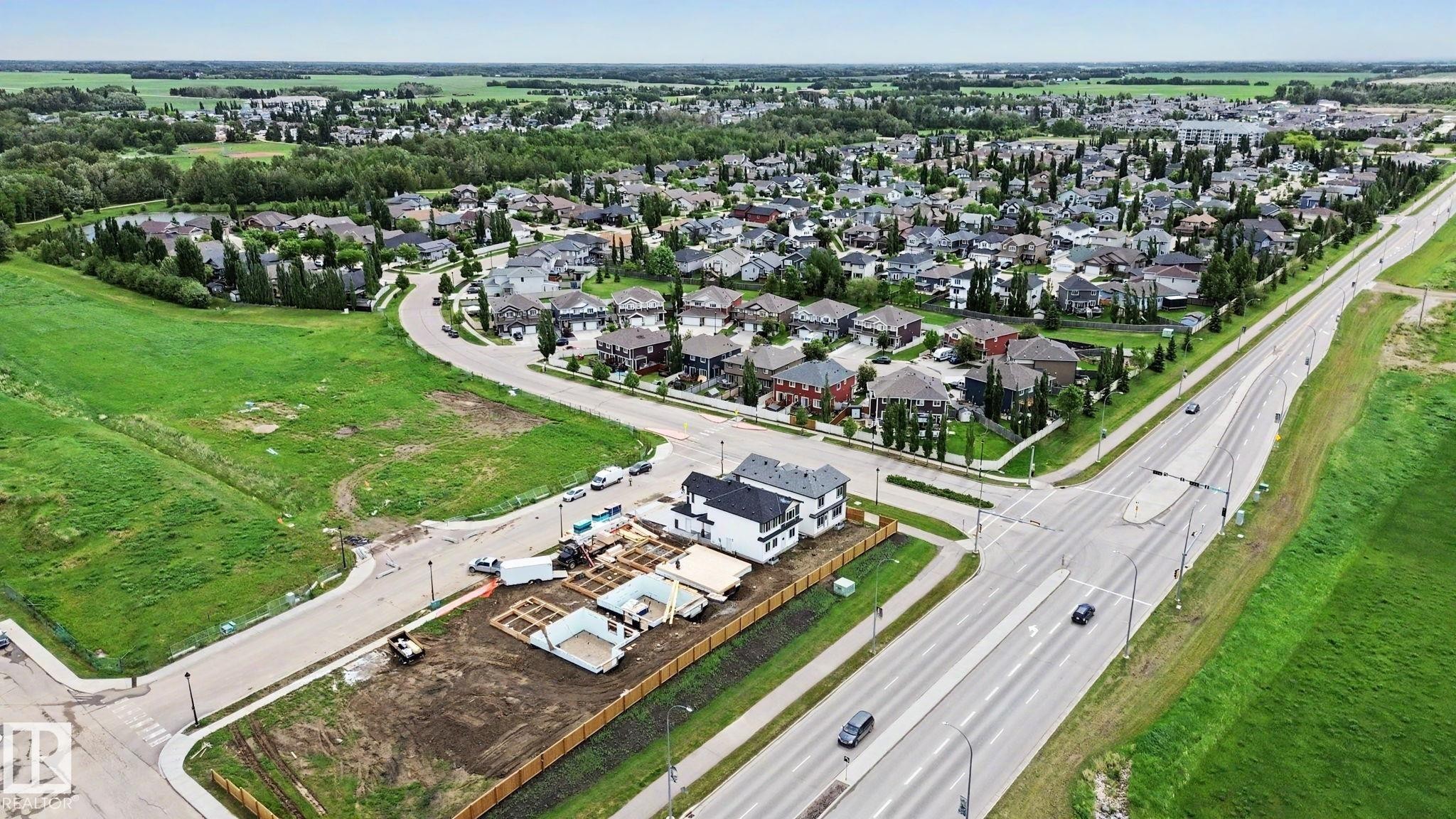 Expansive suburban landscape featuring established residential areas and undeveloped land parcels - 4 Willow Heights Drive, Stony Plain, AB