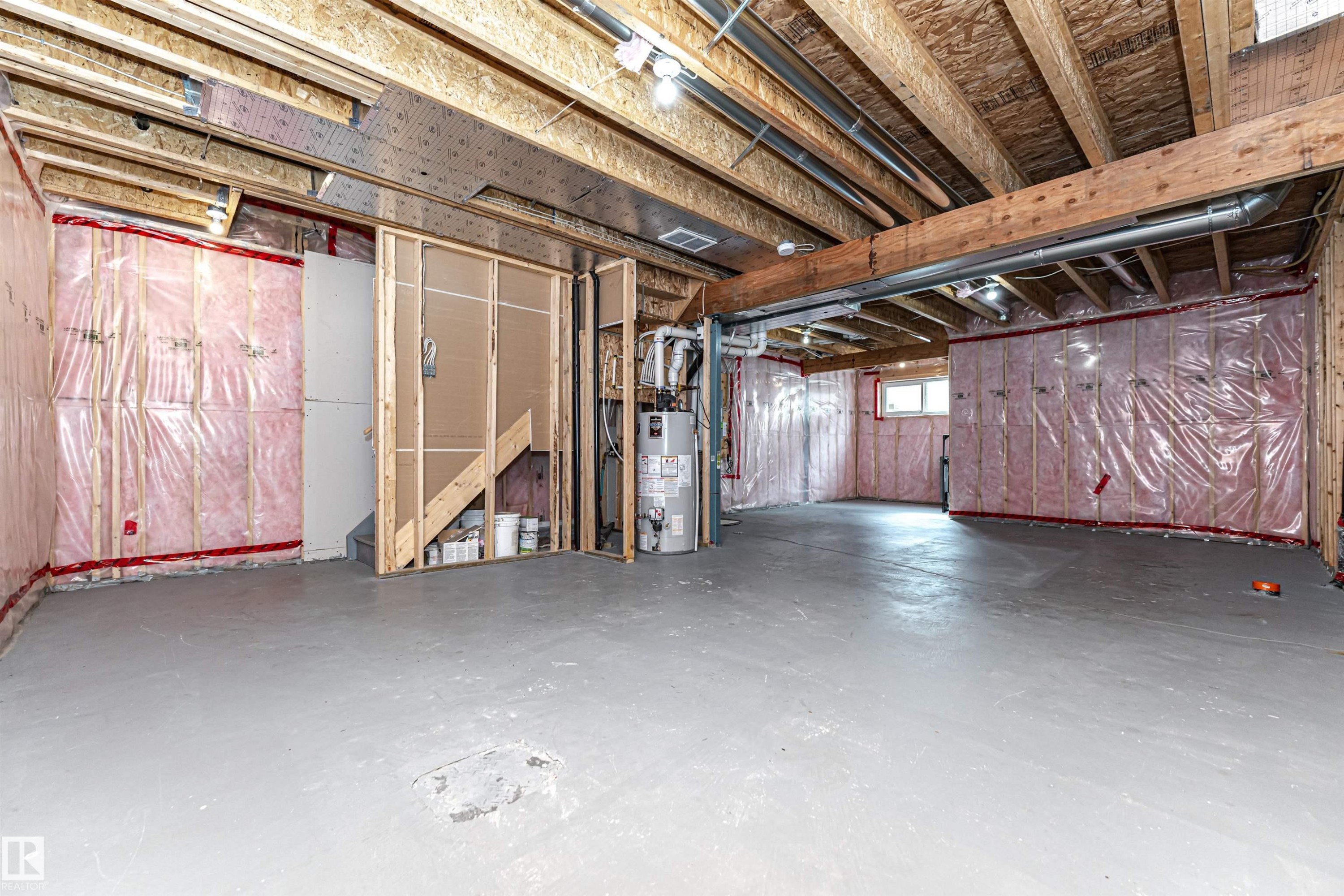 Unfinished basement offering exposed wood framing, insulated walls, and a concrete floor - 2397 Glenridding Boulevard, Edmonton, AB