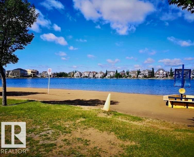 Lakeside setting with a sandy beach and green space - 184 1804 70 Street, Edmonton, AB