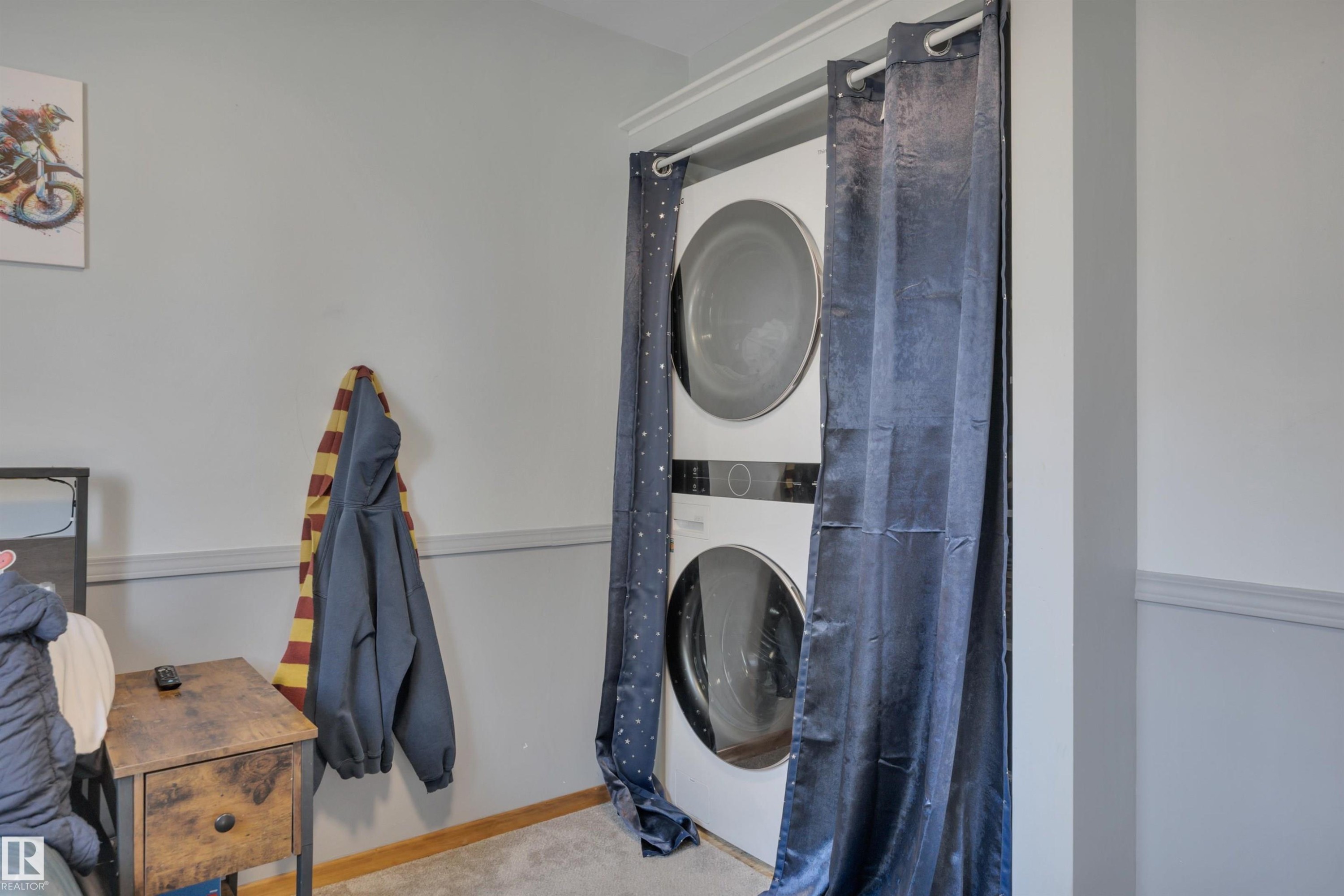 Integrated stackable laundry appliances featuring a front-load washer and dryer - 9835 74 Street, Edmonton, AB