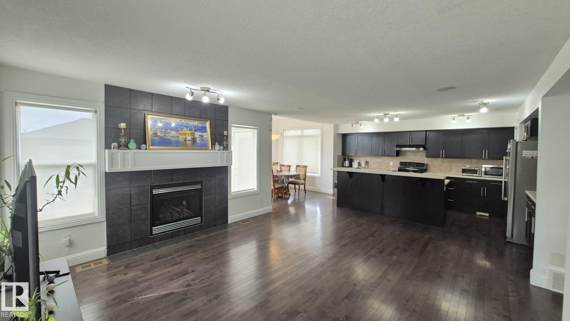 5440 1A Avenue, Edmonton, AB - Indoor Photo Showing Living Room With Fireplace
