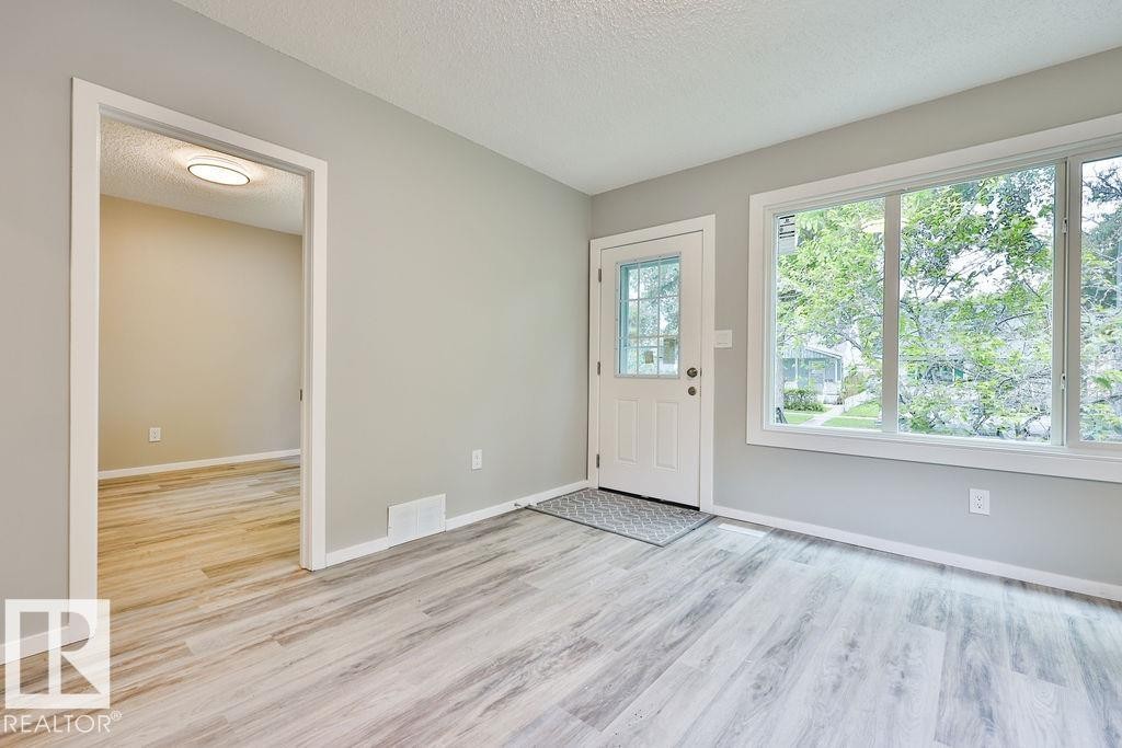 Light gray wall finishes throughout with white trim - 11241 88 Street, Edmonton, AB