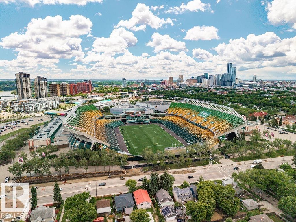 Aerial perspective showcasing a prominent stadium surrounded by urban development - 11241 88 Street, Edmonton, AB