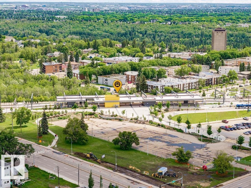 Aerial perspective showcasing a vibrant urban landscape with extensive green spaces and established residential areas - 11241 88 Street, Edmonton, AB