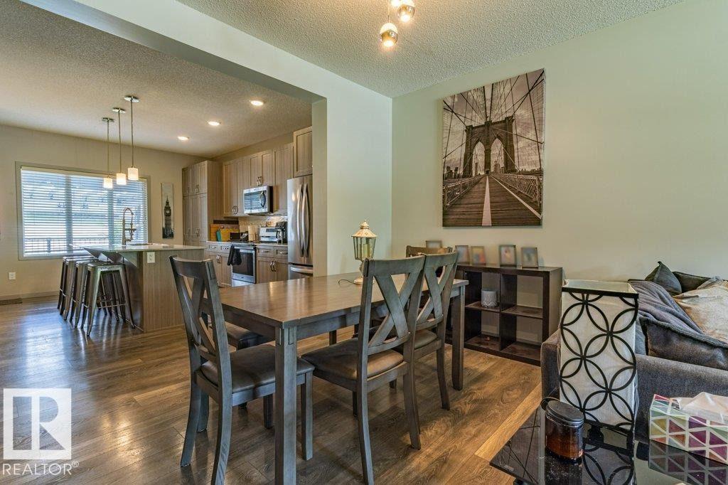 Dining area with wood-finish flooring - 17123 49 Street, Edmonton, AB