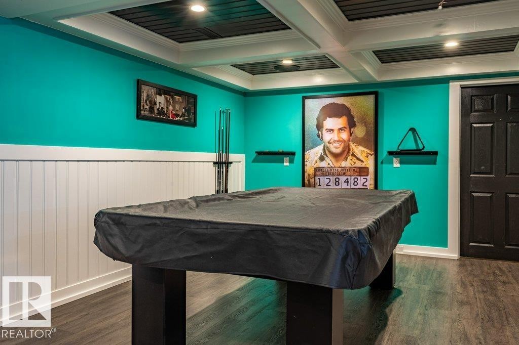Recreational space featuring a pool table, wood-finish flooring, and a coffered ceiling with recessed lighting - 17123 49 Street, Edmonton, AB