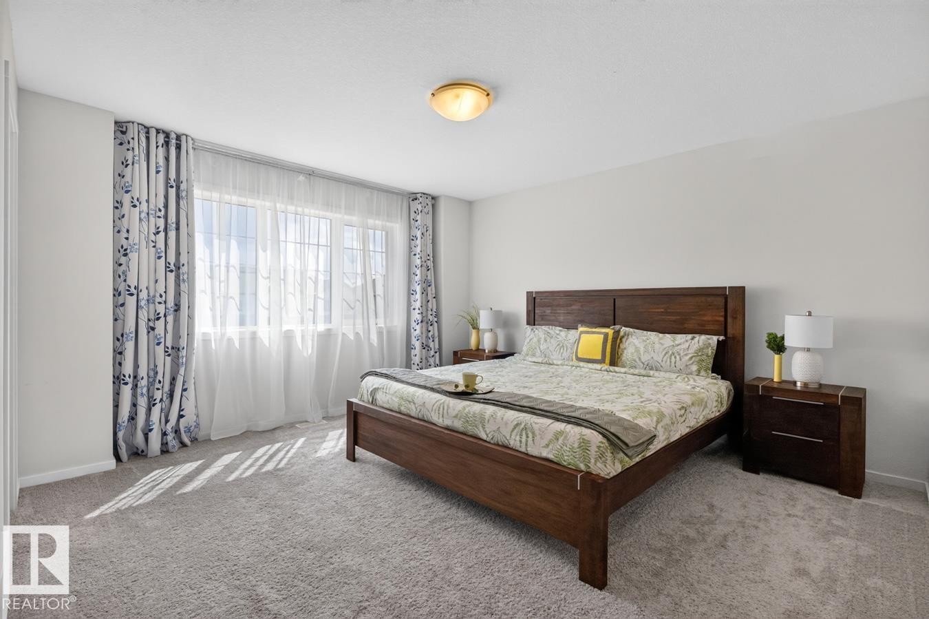 Room featuring broad window with sheer and patterned drapes - 1022 Hearthstone Boulevard, Sherwood Park, AB
