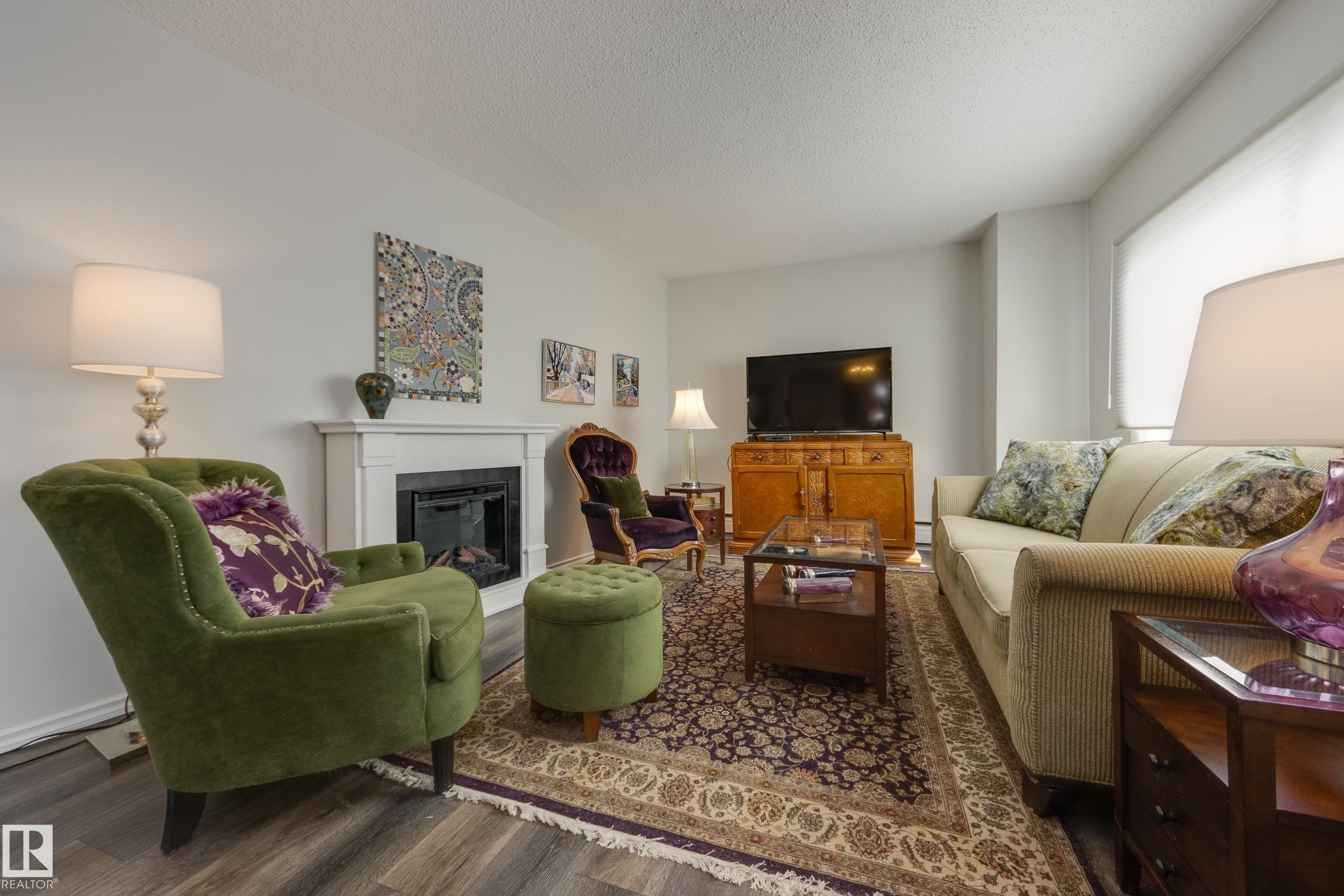#1001 9909 110 St Nw, Edmonton, AB - Indoor Photo Showing Living Room With Fireplace