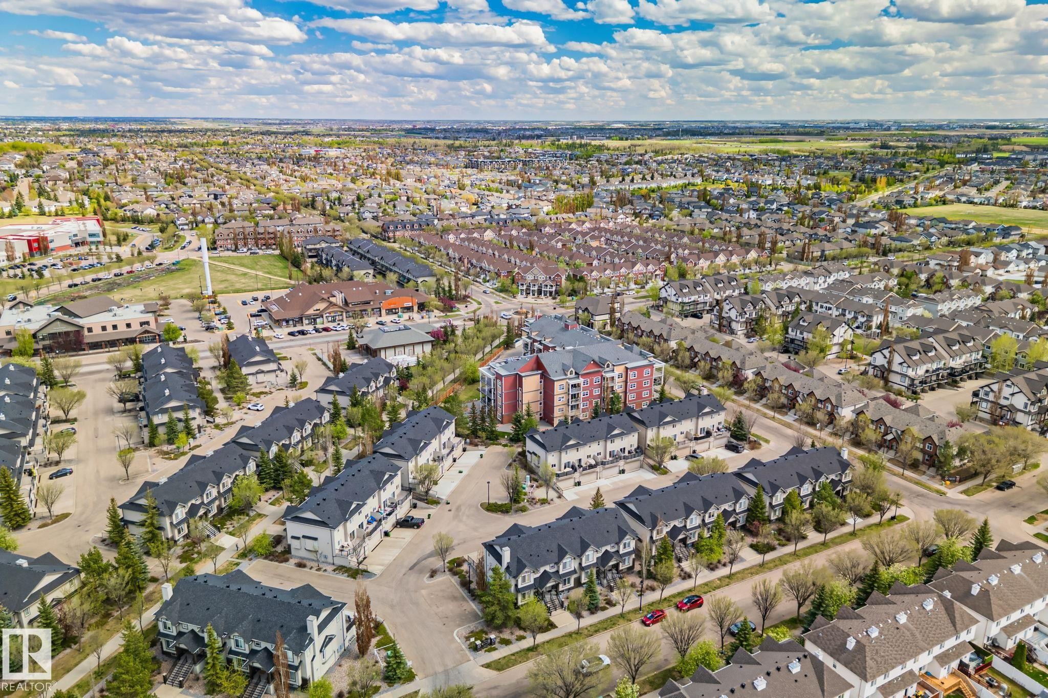 Expansive aerial capturing a densely developed residential area with varied housing types - 209 5280 Terwillegar Boulevard, Edmonton, AB - Outdoor With View