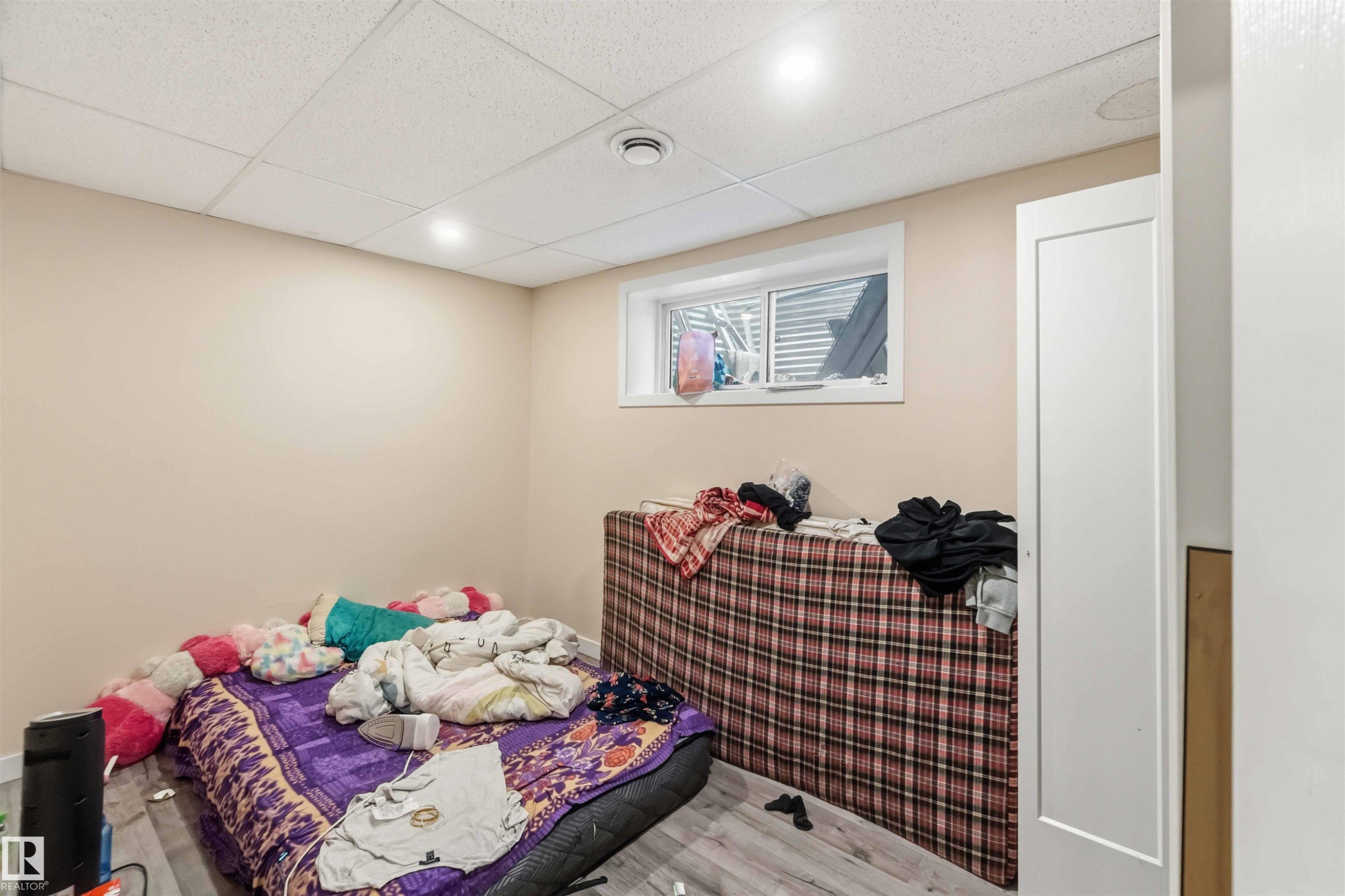 Room featuring light-toned walls, recessed lighting, and wood-finish flooring - 5120 19 Avenue, Edmonton, AB
