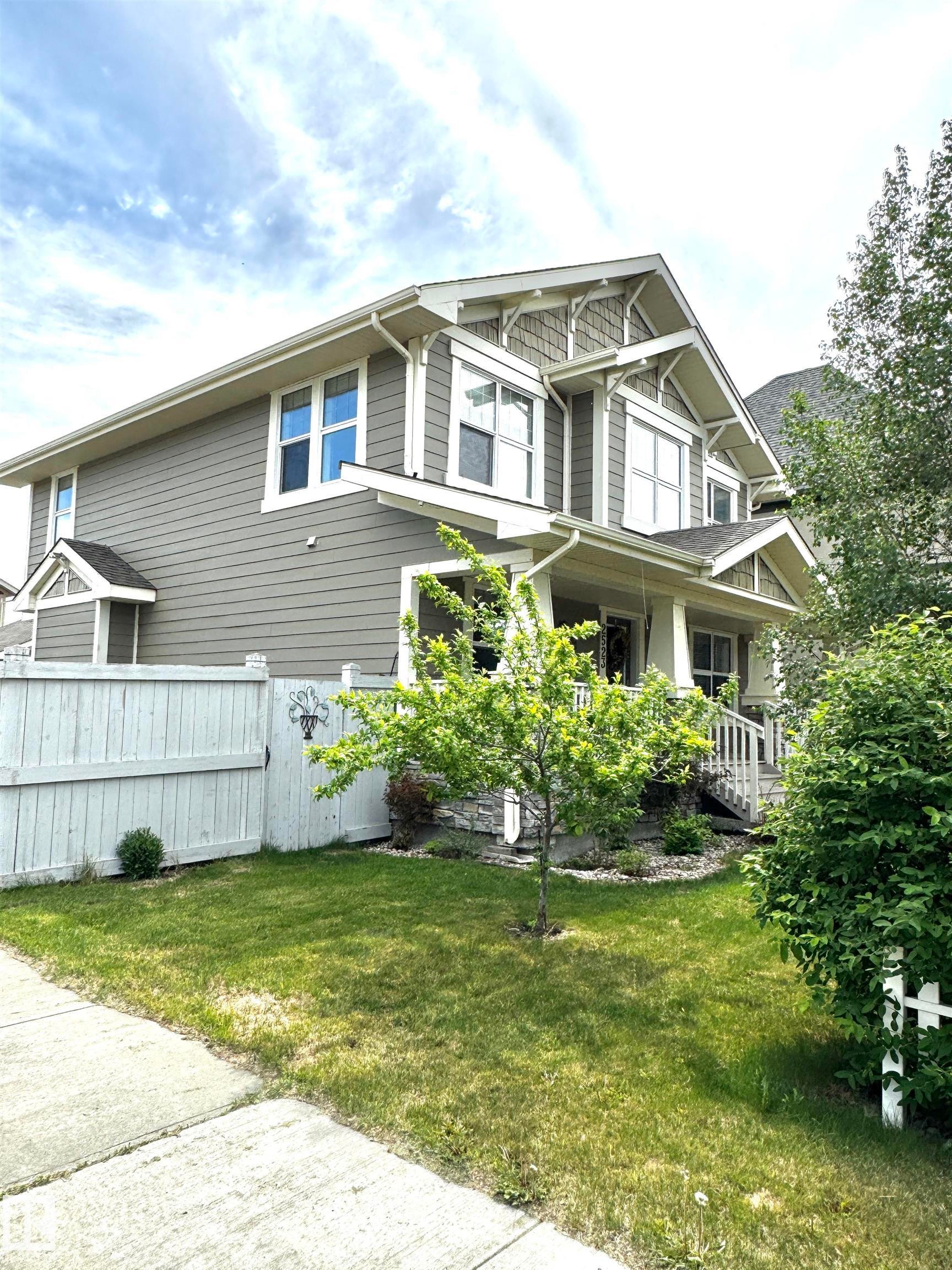Two-story residence featuring grey horizontal siding and white trim - 2523 Pegasus Boulevard, Edmonton, AB