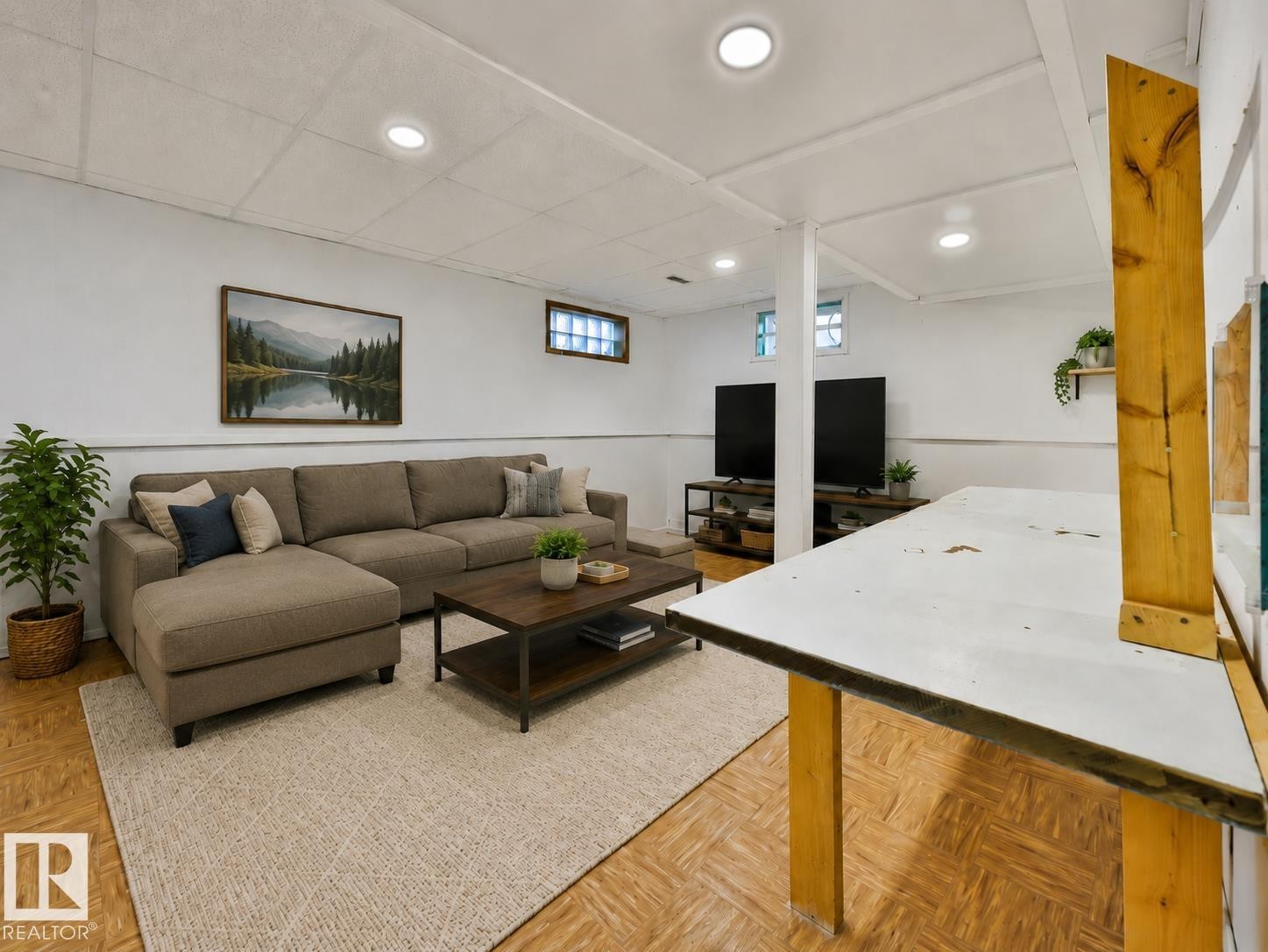 Recreational space featuring recessed lighting, paneled ceiling, wood-finish flooring, and glass block windows - 8318 80 Avenue, Edmonton, AB