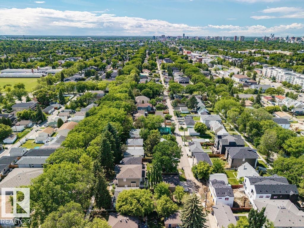 Aerial perspective showcasing a residential area with mature tree-lined streets - 8318 80 Avenue Nw, Edmonton, AB - Outdoor With View