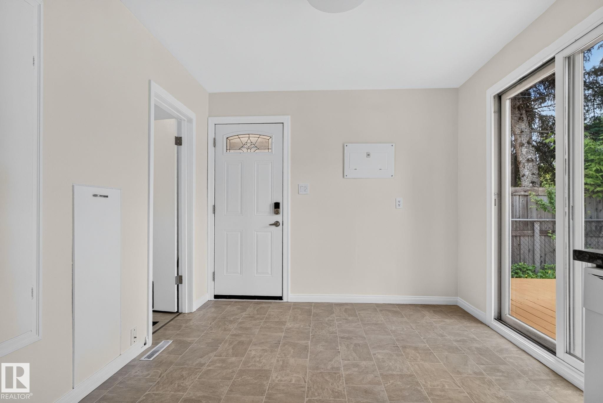 Interior space featuring tile flooring and light-toned walls - 12952 114 Street Nw, Edmonton, AB