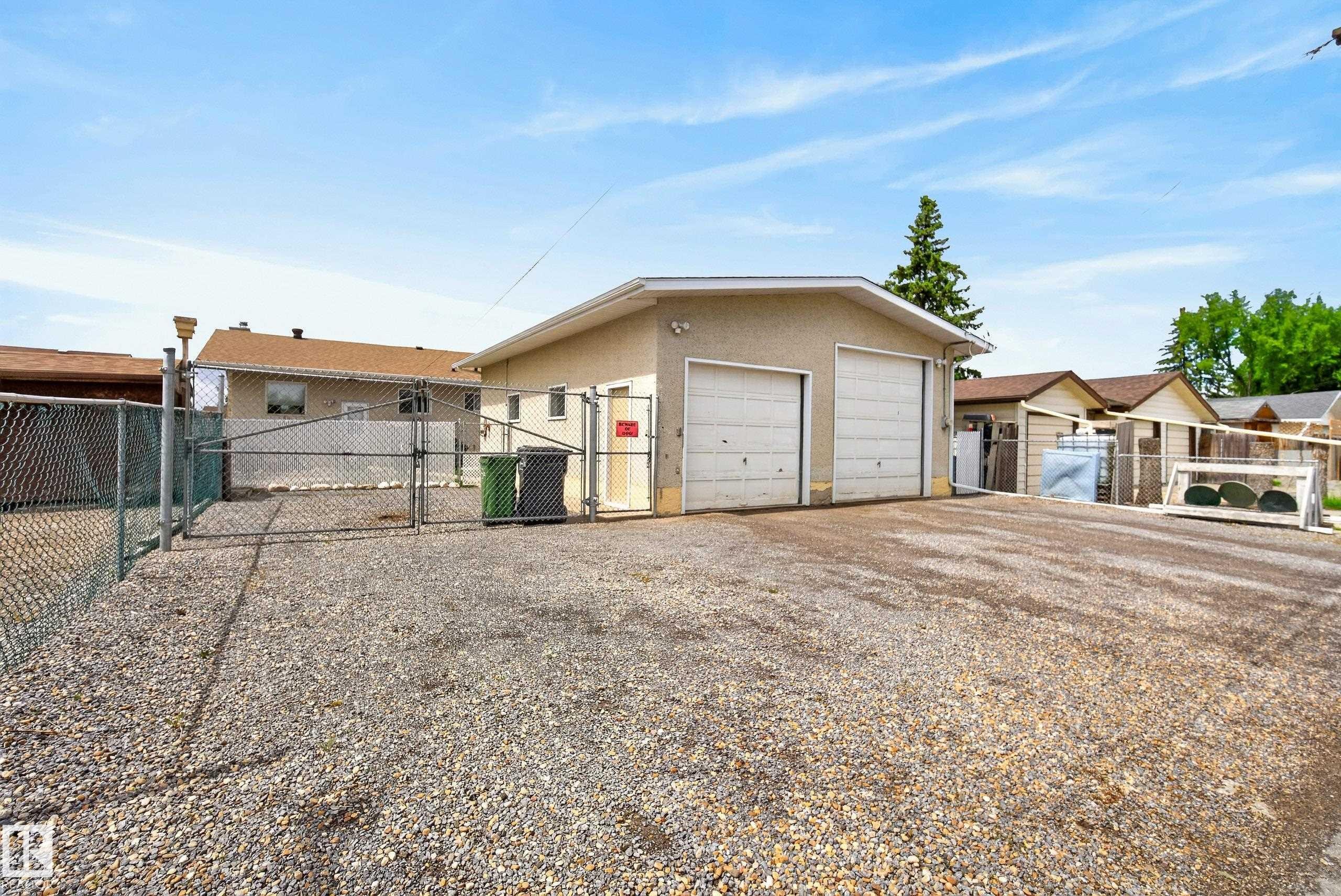 Two-car detached garage with stucco exterior and dual overhead doors - 10935 152 Street, Edmonton, AB