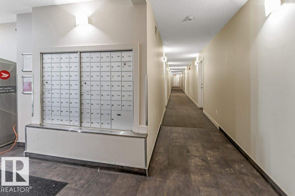 Shared hallway featuring recessed lighting and wall sconces - 401 667 Watt Boulevard, Edmonton, AB
