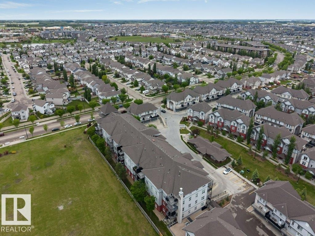 Expansive community aerial showcasing numerous residential properties - 401 667 Watt Boulevard, Edmonton, AB