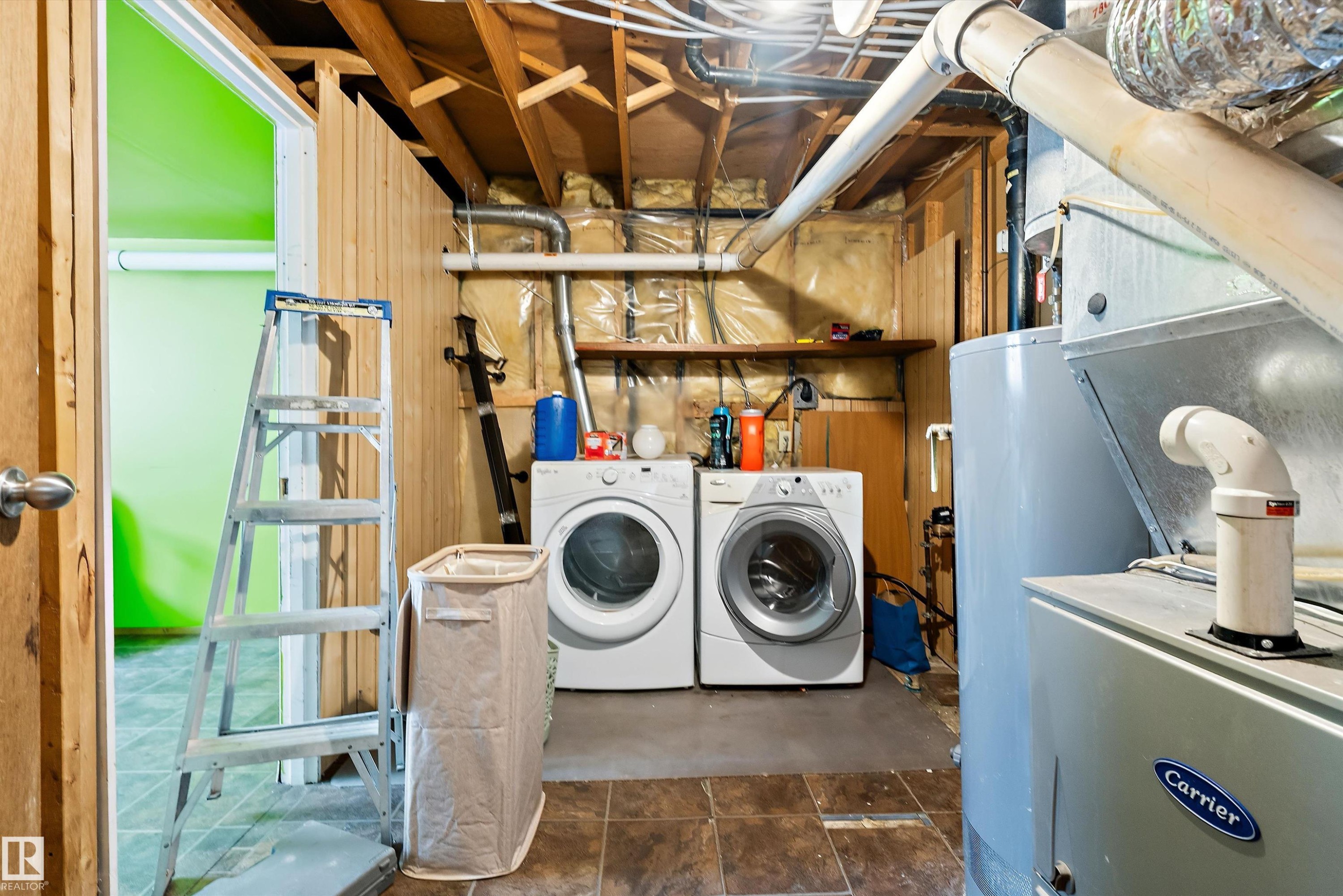 Basement utility area featuring exposed joists, comprehensive ductwork, and a water heater - 14707 33 Street, Edmonton, AB