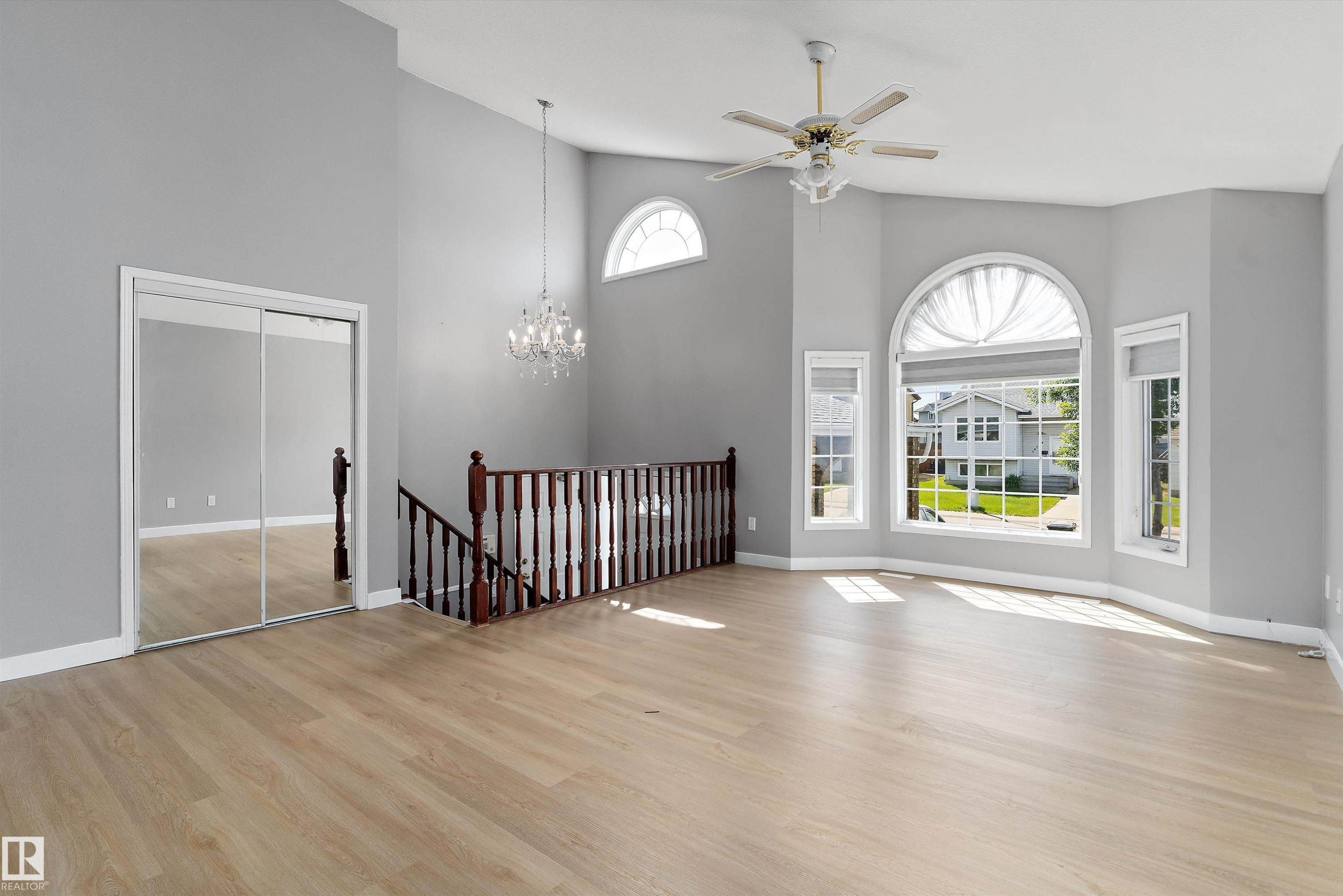 Vaulted ceiling great room with wood-finish flooring - 14707 33 Street, Edmonton, AB