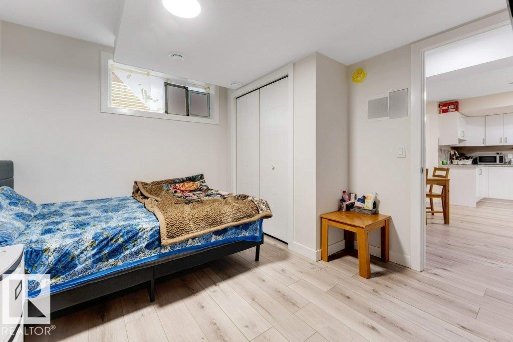 Room featuring light wood-finish flooring, white walls, and a recessed ceiling light - 3511 15A Street, Edmonton, AB