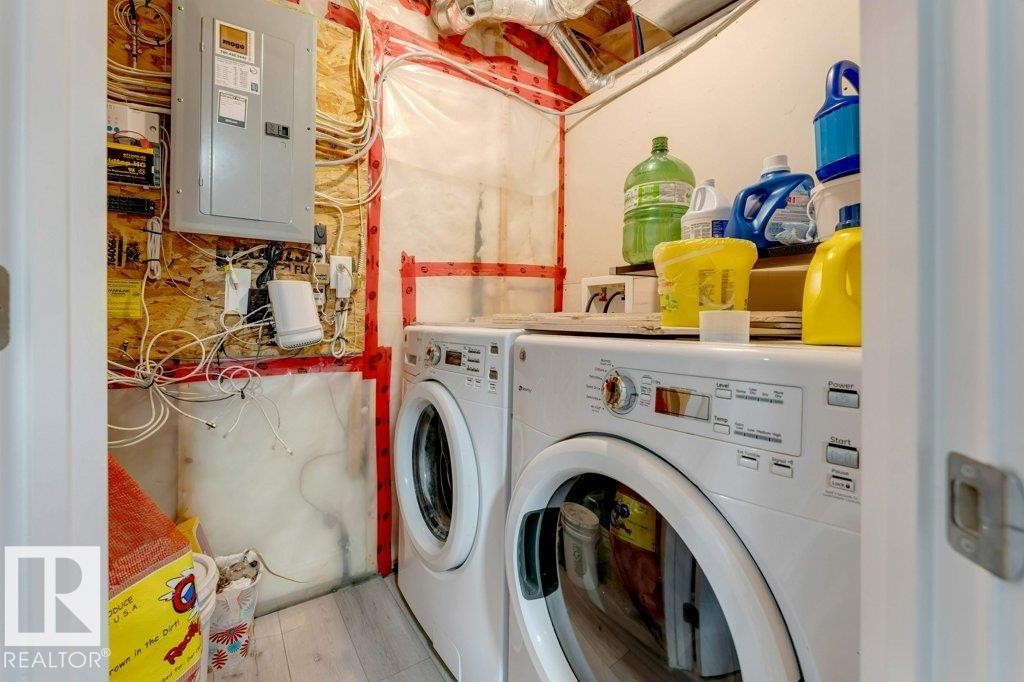 Dedicated utility space featuring washer and dryer units - 3511 15A Street, Edmonton, AB