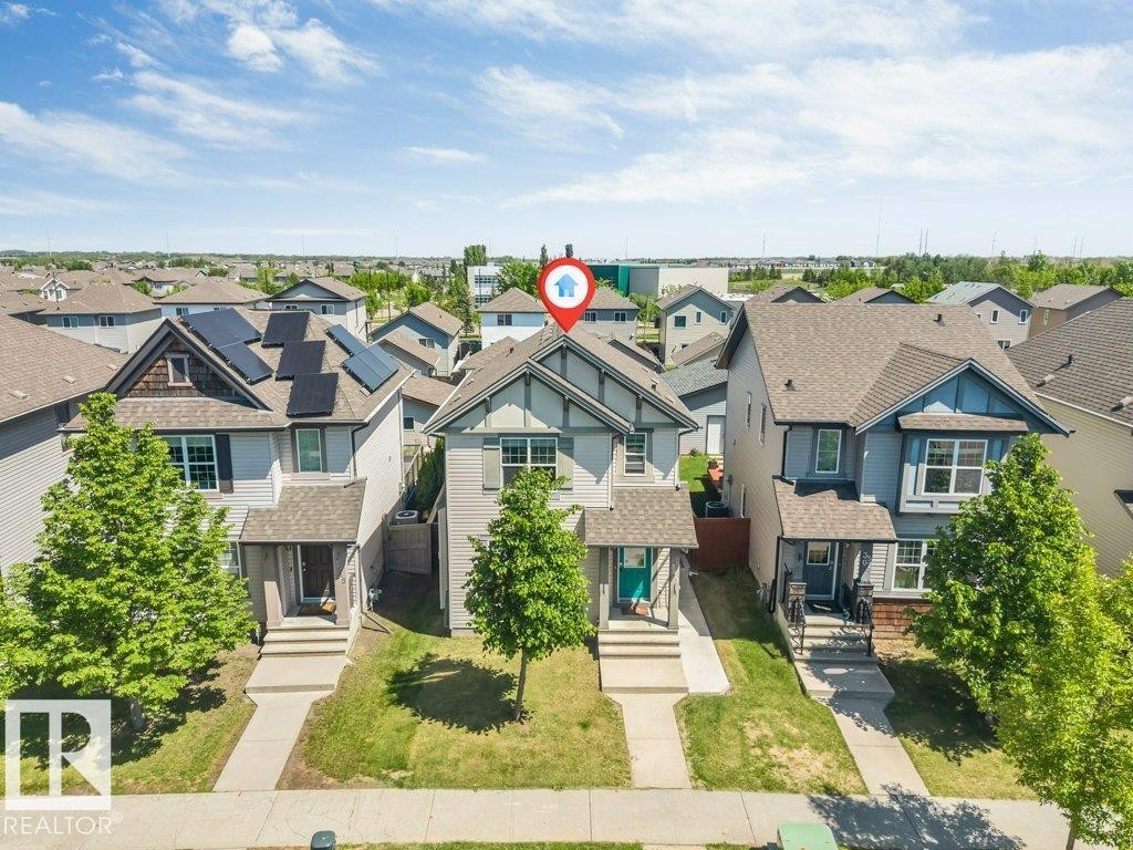 Two-story residence featuring a gabled roofline and an inviting front porch - 3511 15A Street, Edmonton, AB