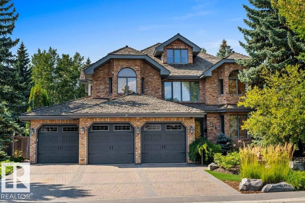 Paving stone driveway and reclaimed brick exterior. - 738 Wheeler Road, Edmonton, AB