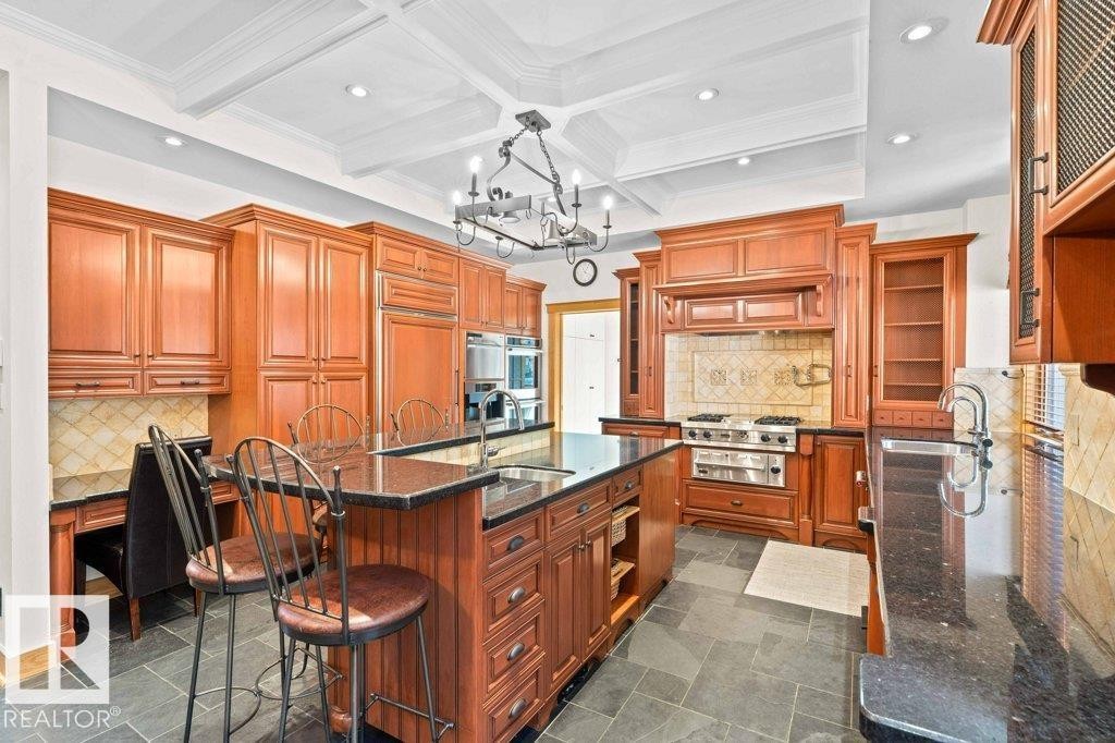 Granite countertops, custom cherry wood cabinets, carburetors and Grohe faucets. - 738 Wheeler Road, Edmonton, AB