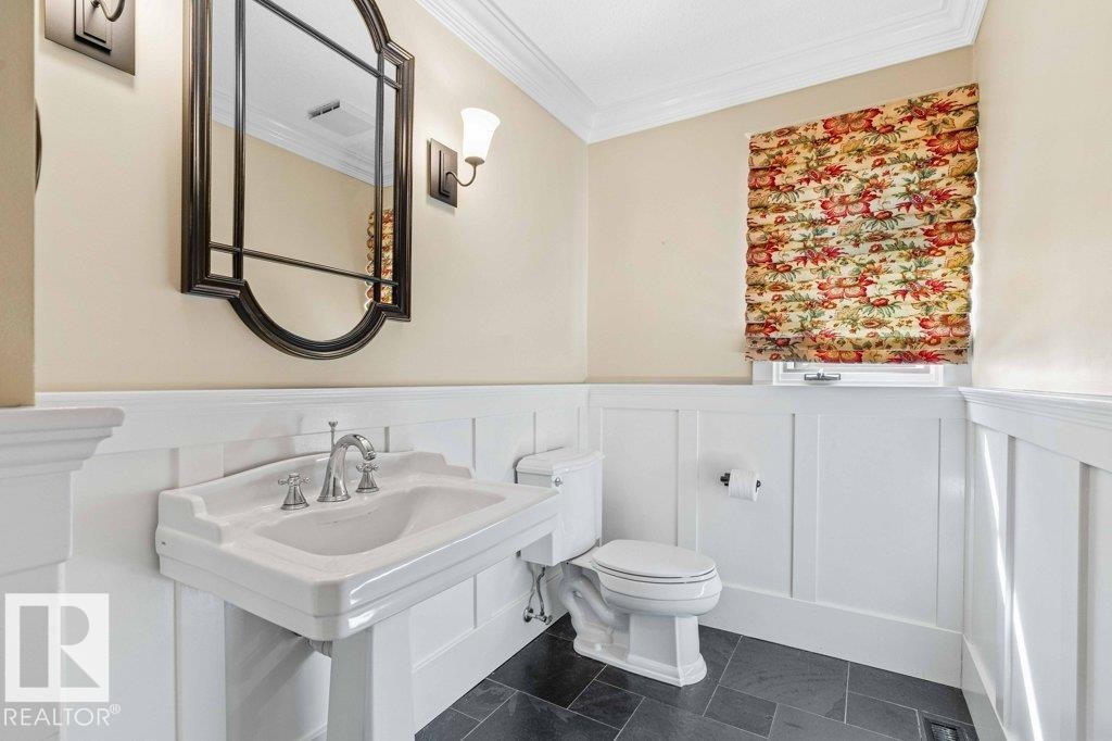 Wainscoted wall and Grohe faucets. - 738 Wheeler Road, Edmonton, AB