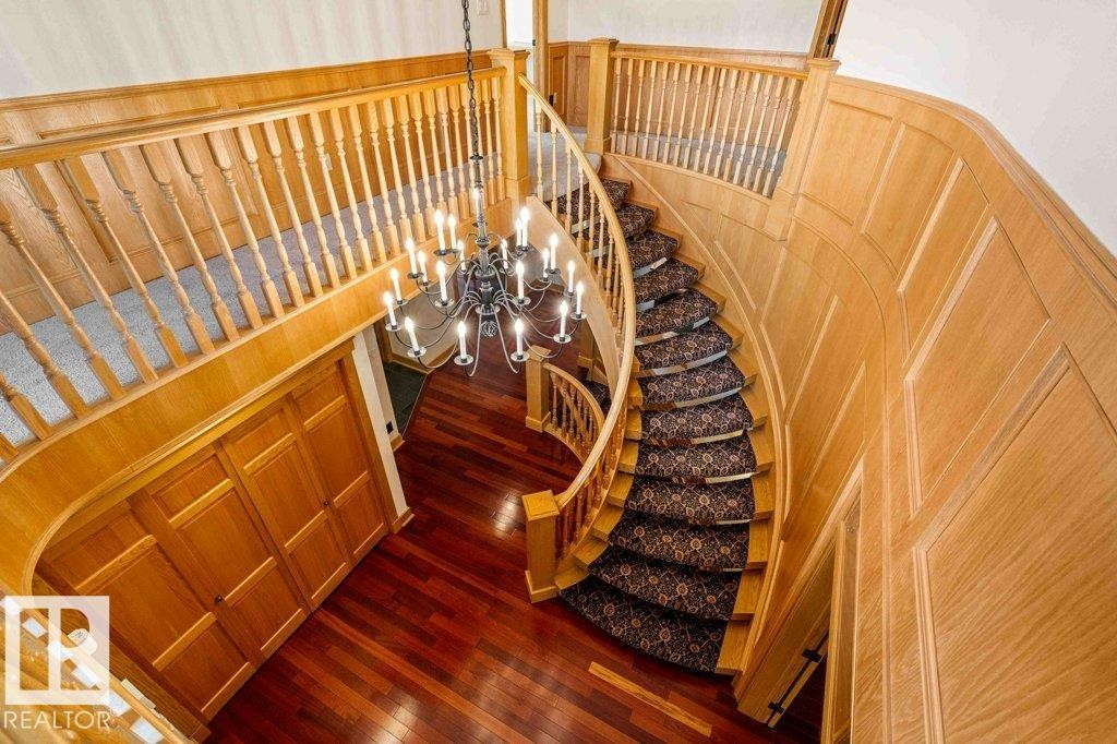 Curved oak staircase featuring luxury wool carpeting. - 738 Wheeler Road, Edmonton, AB