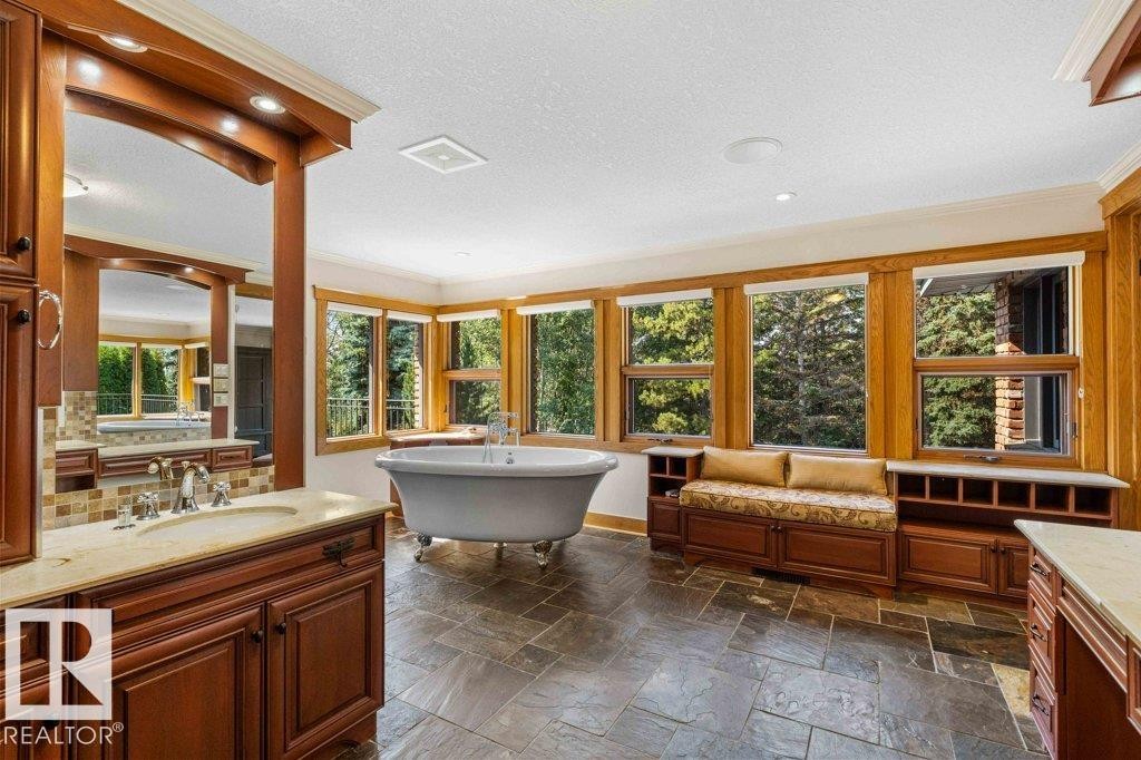 Master ensuite with heated slate flooring, steam shower, Grohe taps throughout, hydronic heated towel bar and air jetted tub. - 738 Wheeler Road, Edmonton, AB