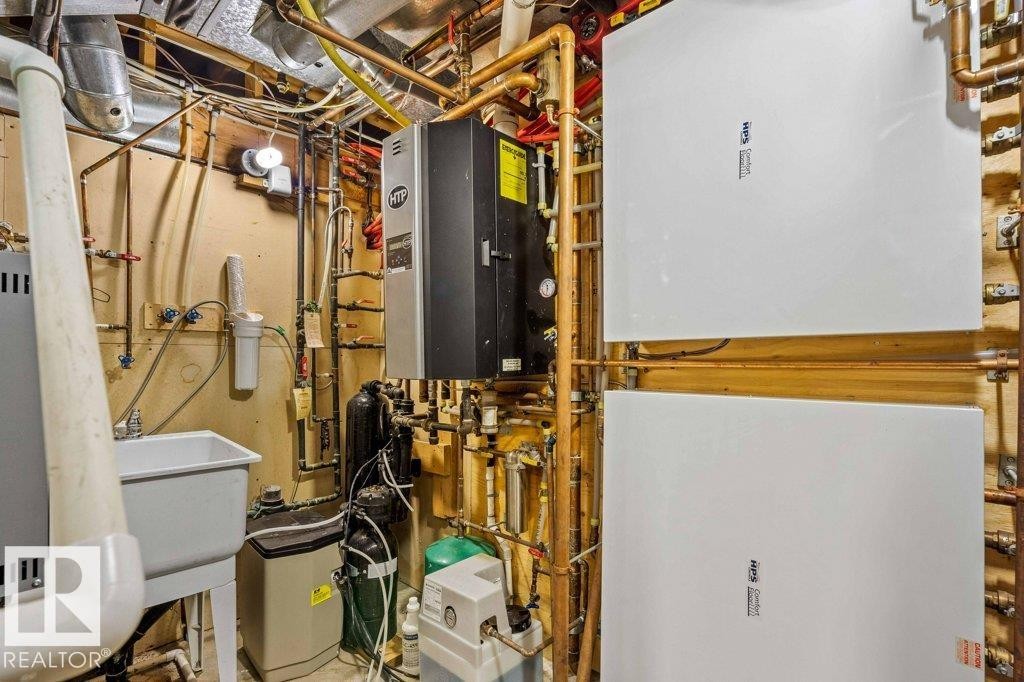 Utility room with boiler and 3 furnaces. - 738 Wheeler Road, Edmonton, AB