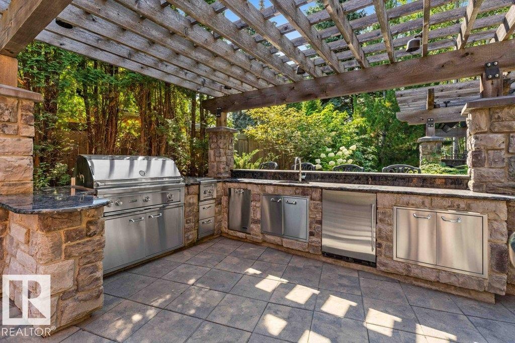 View of patio / terrace with a pergola and area for grilling - 738 Wheeler Road, Edmonton, AB