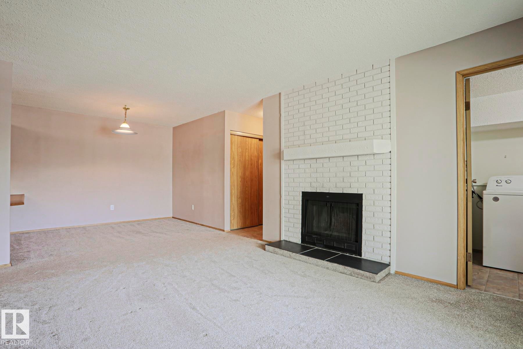 203 44 Alpine Place, St. Albert, AB - Indoor With Fireplace