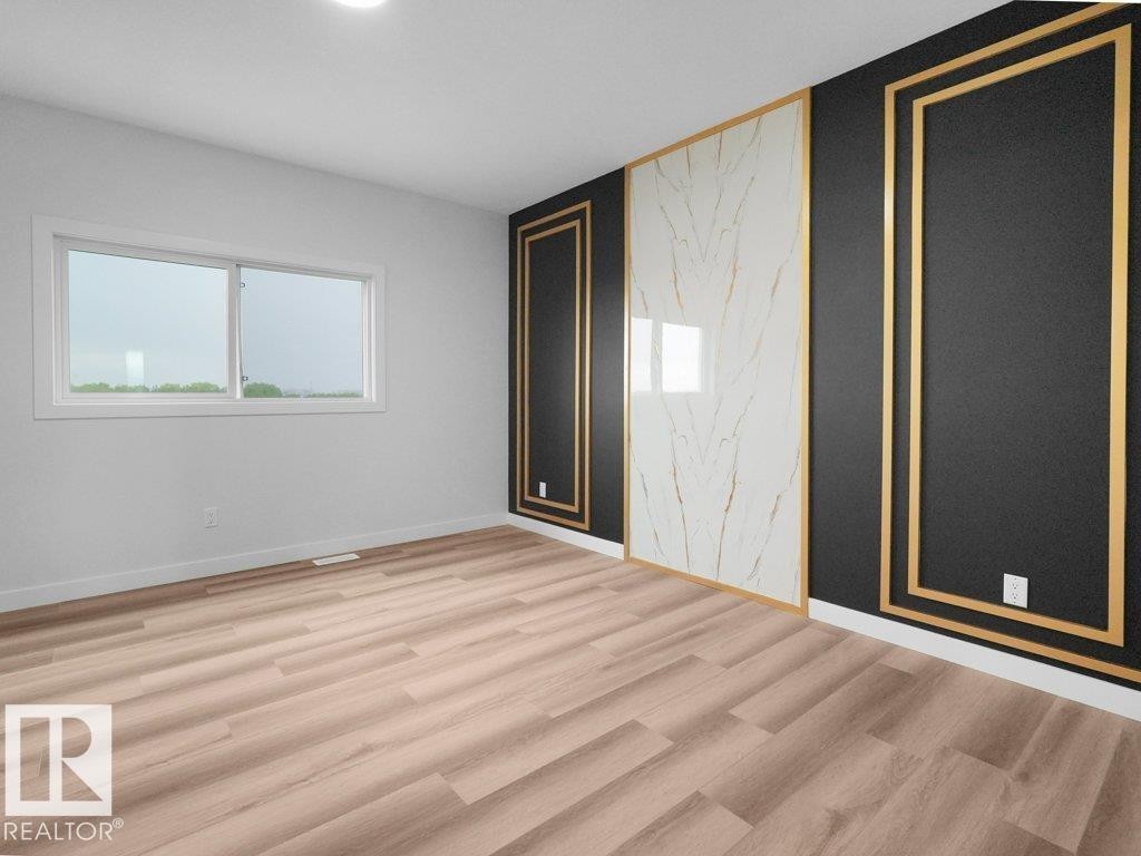 Accent wall featuring black and white panels with gold trim - 18719 130 Street Nw, Edmonton, AB