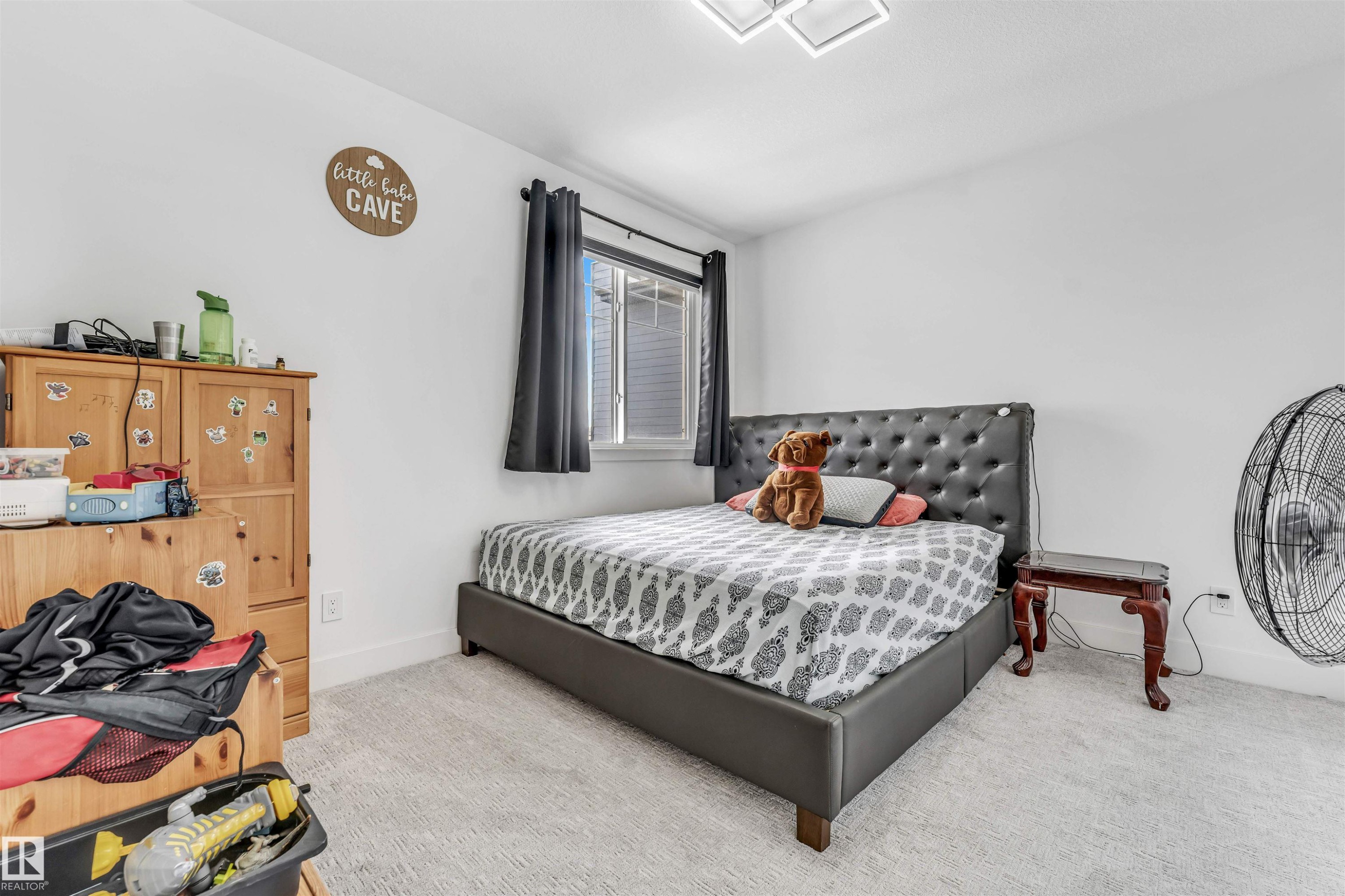 Bedroom featuring light-colored carpet flooring and white walls - 208 33 Street, Edmonton, AB