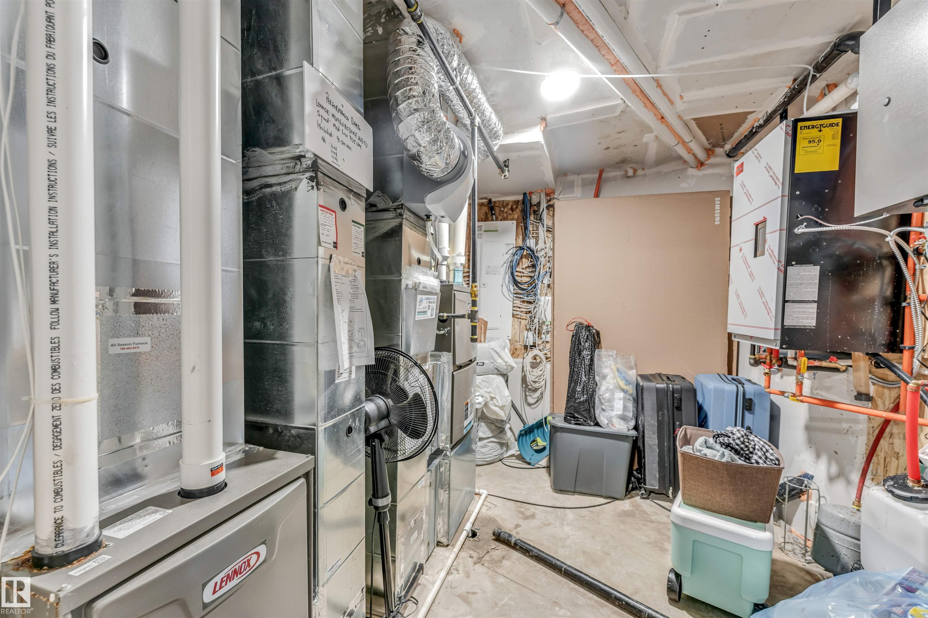 Utility area featuring a forced-air furnace, extensive ductwork, and various mechanical systems - 208 33 Street, Edmonton, AB
