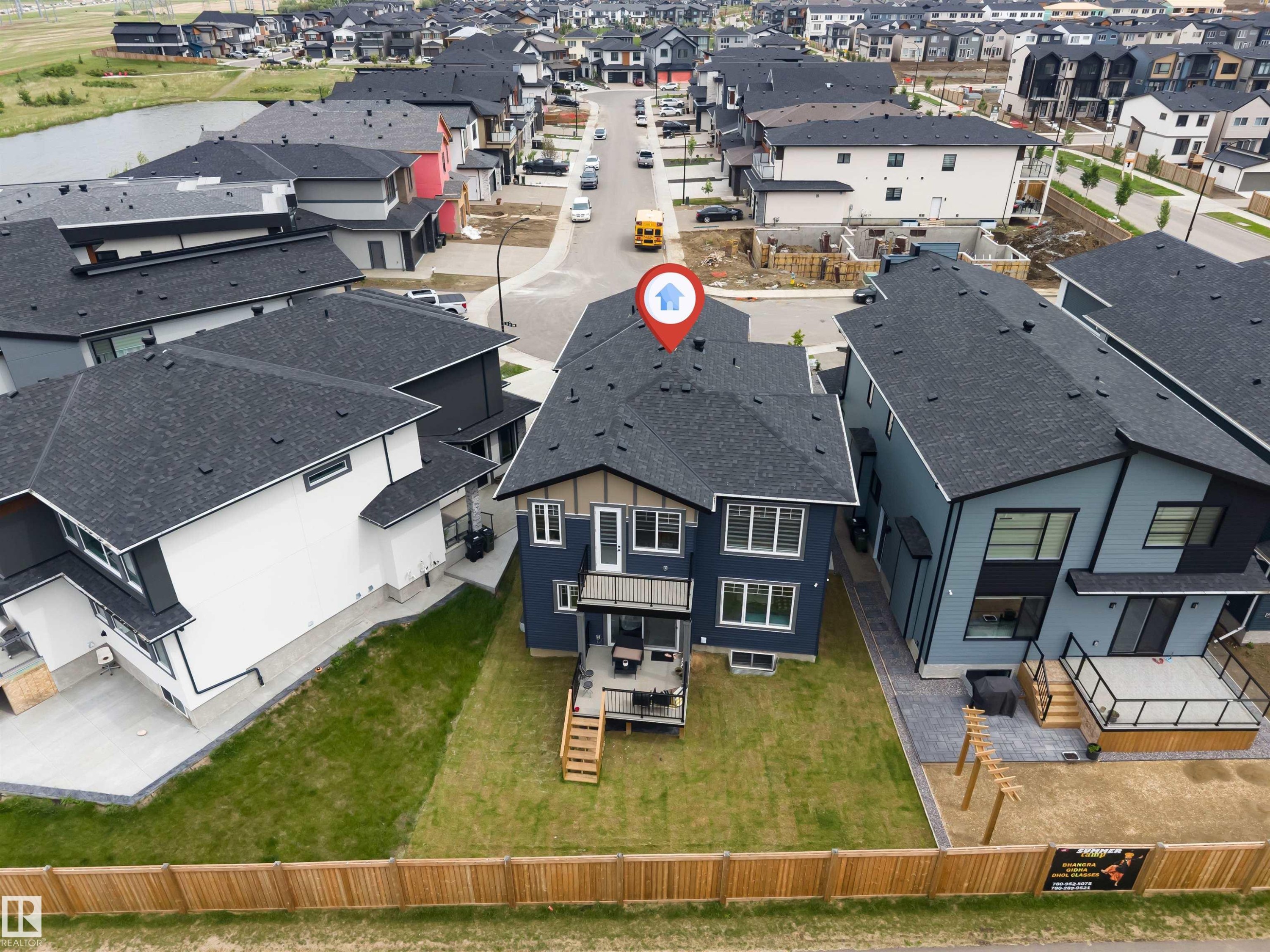 Contemporary residential property featuring a dark-toned exterior facade with light trim accents - 208 33 Street, Edmonton, AB