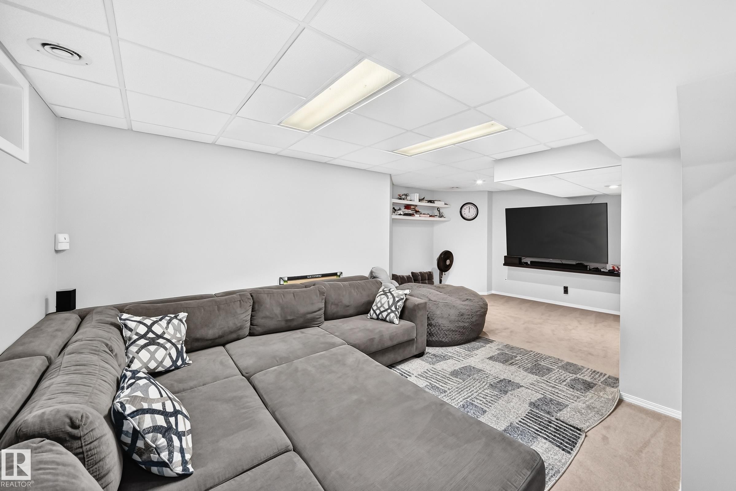 Finished lower level featuring recessed lighting, a drop ceiling, and neutral carpeting - 4216 47 Street, Edmonton, AB