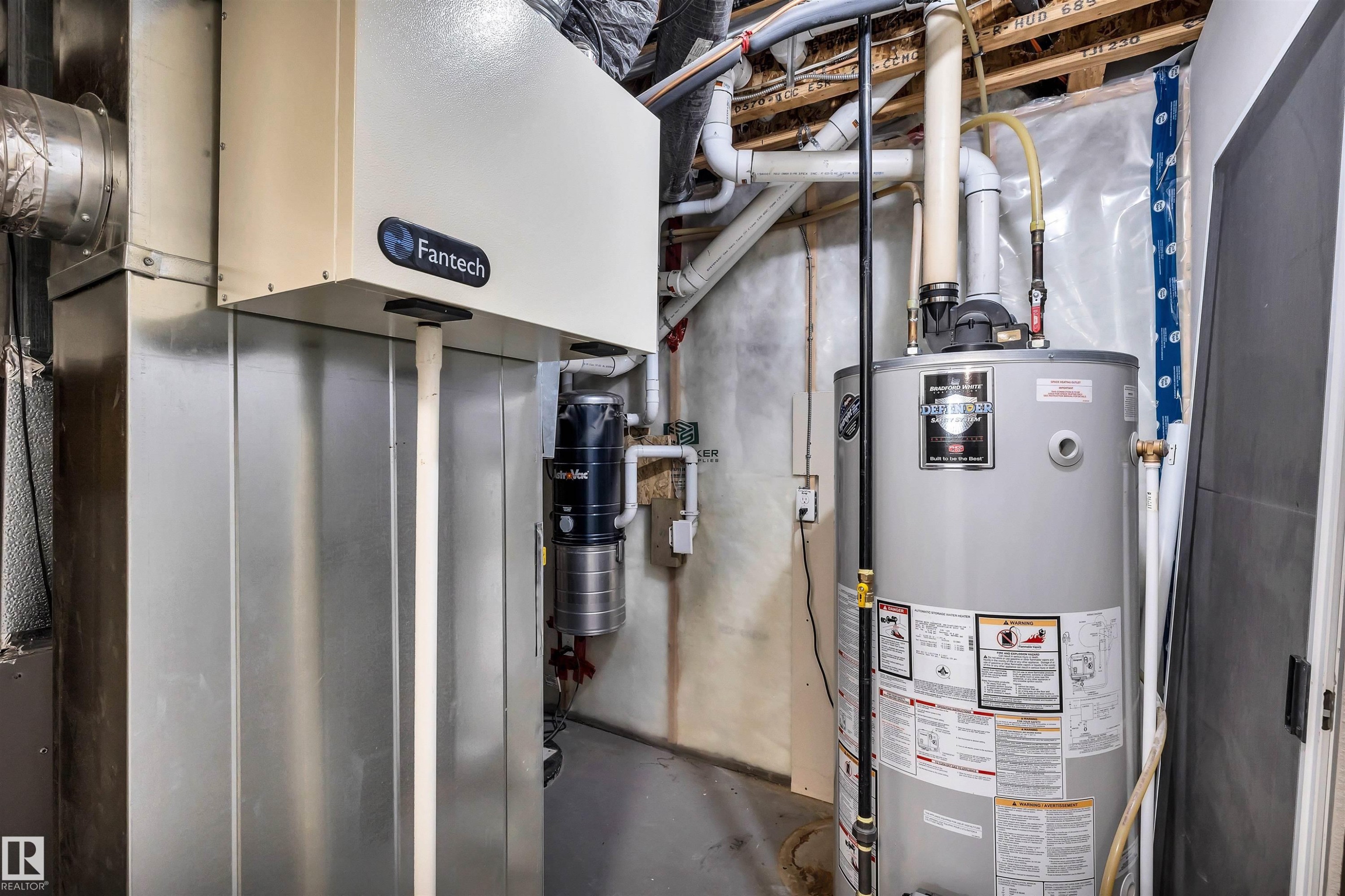 Mechanical room featuring a water heater, furnace, and exposed overhead piping - 18 Voleta Crest, Spruce Grove, AB
