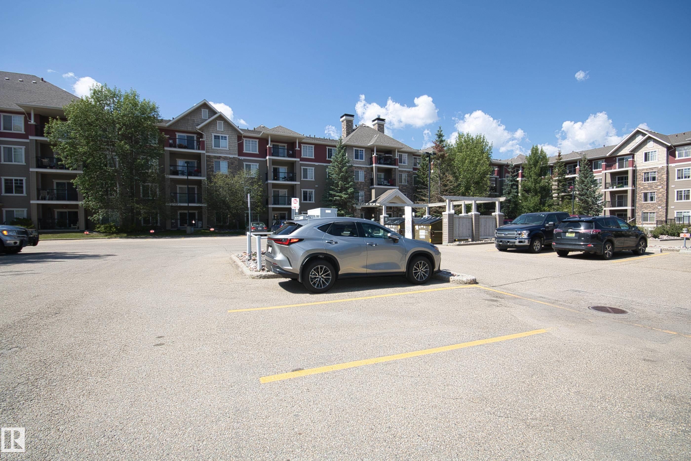 View of uncovered parking lot - 311 2098 Blackmud Creek Drive, Edmonton, AB